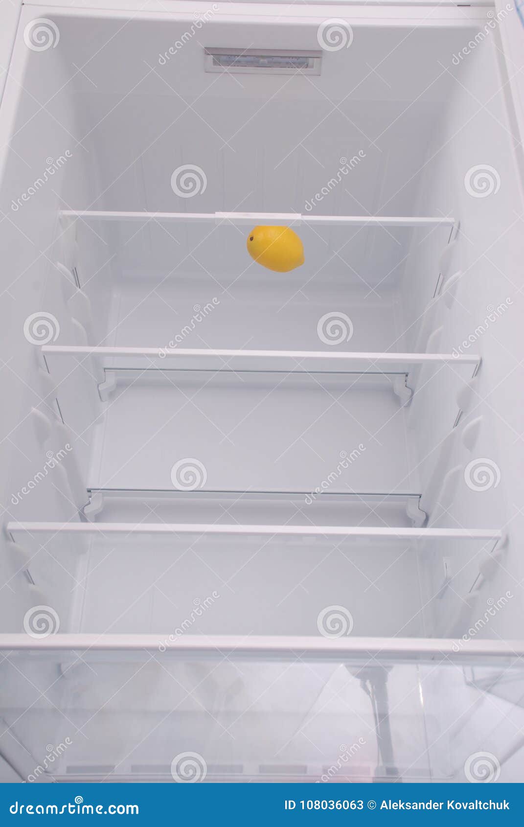 One Lemon in Open Empty Refrigerator. Stock Image Image of poverty