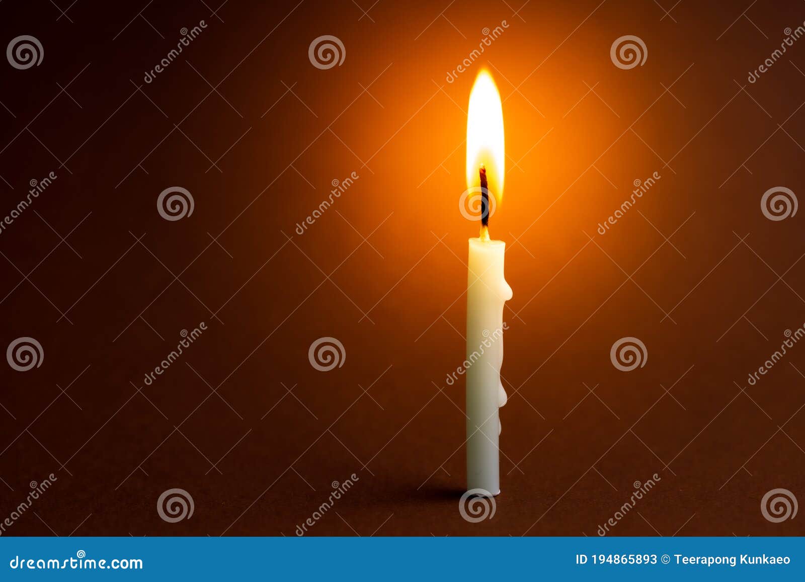 One Light Candle Burning Brightly in the Black Background Stock Image