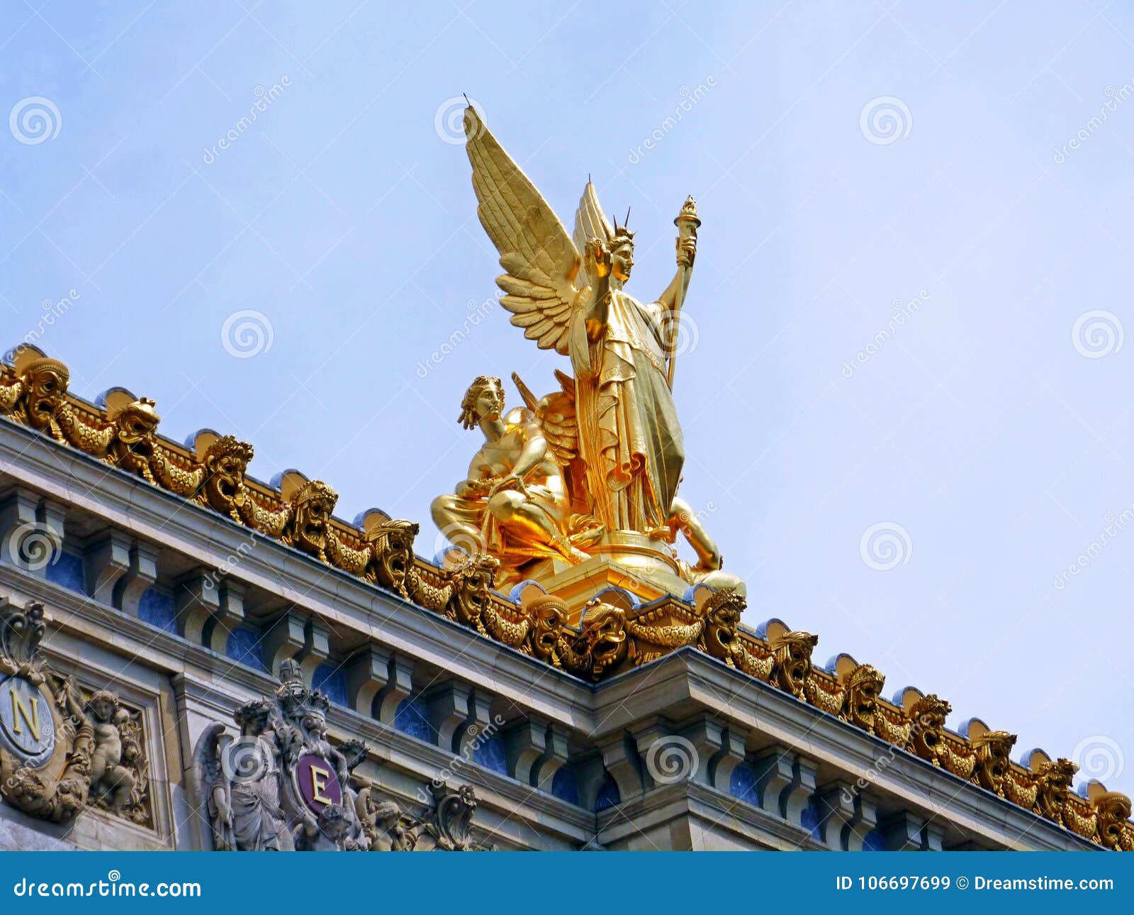 golden sculpture looking sky in paris