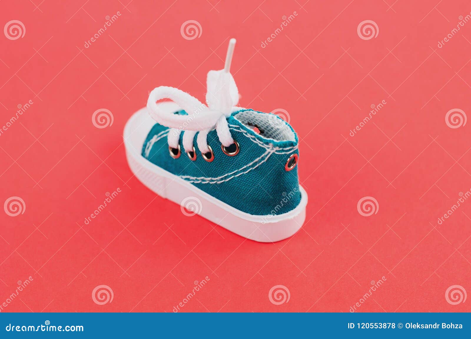 One Green Gym Shoes on Red Paper Stock Photo - Image of paper, shoes ...