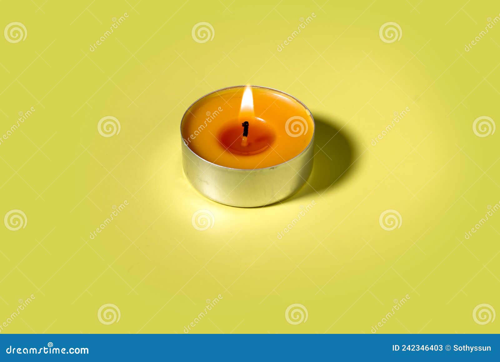 One Orange Lit Aroma Candle on Yellow Background Stock Image Image of
