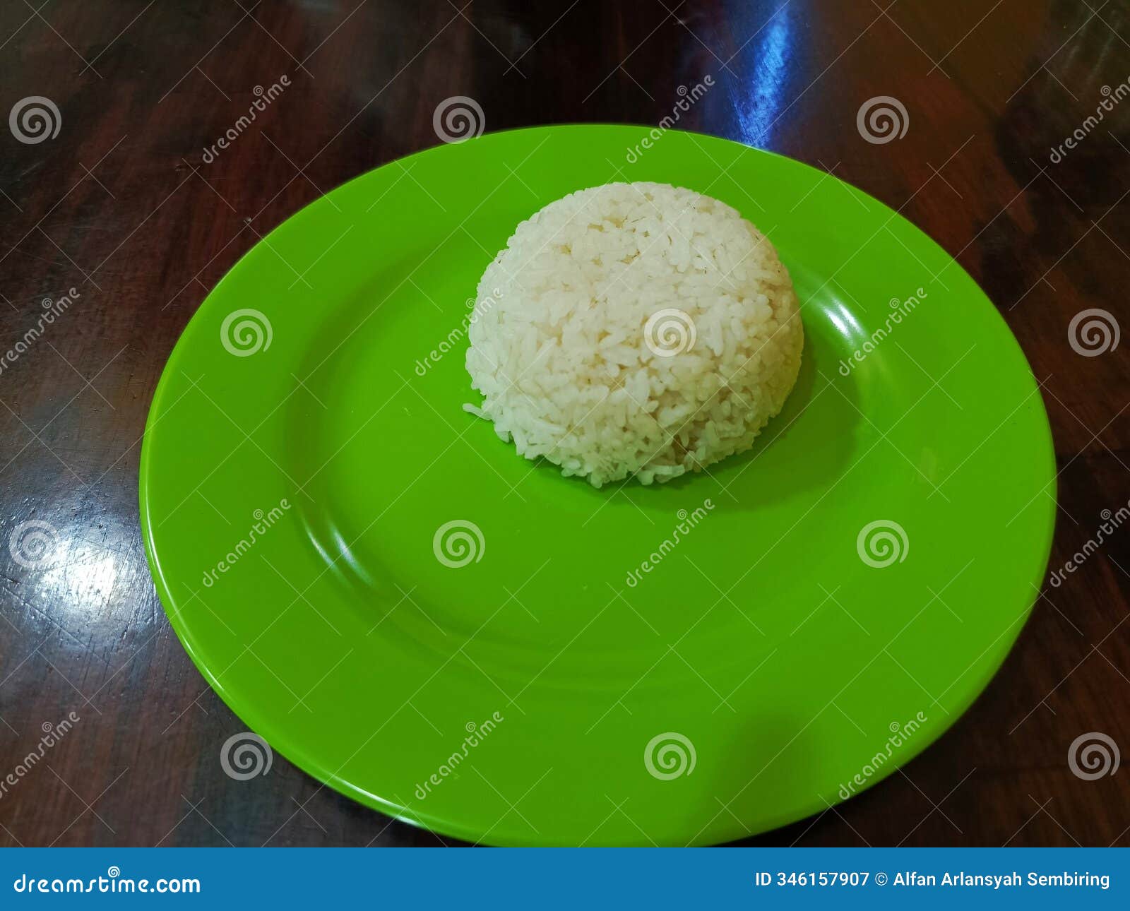 one portion of rice on green plating