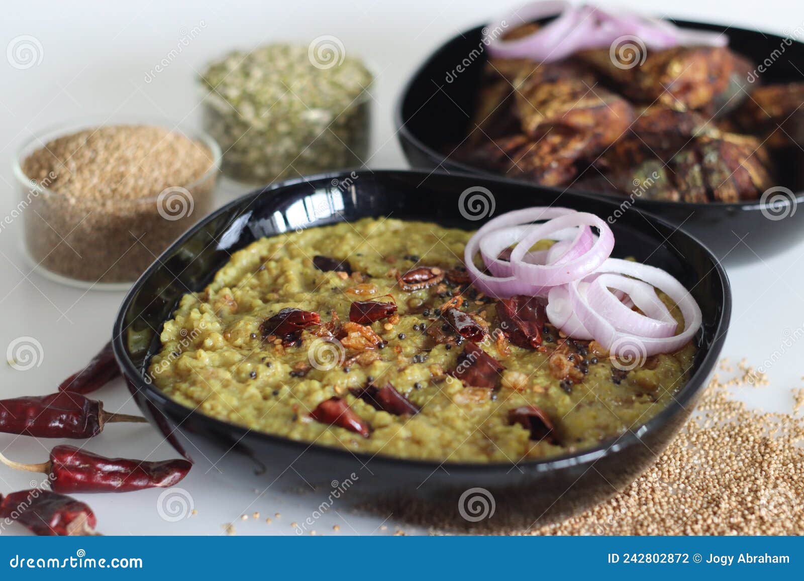 one pot preparation with kodo millet, mung bean lentils. commonly known as kodo millet khichdi in india. served with fried