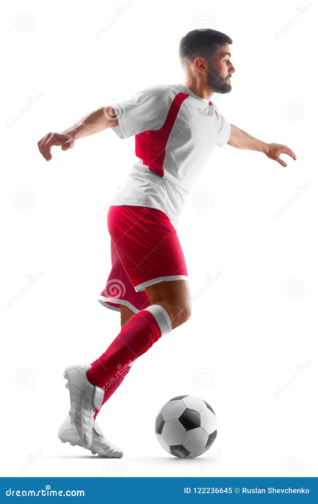 pro soccer player kicking ball