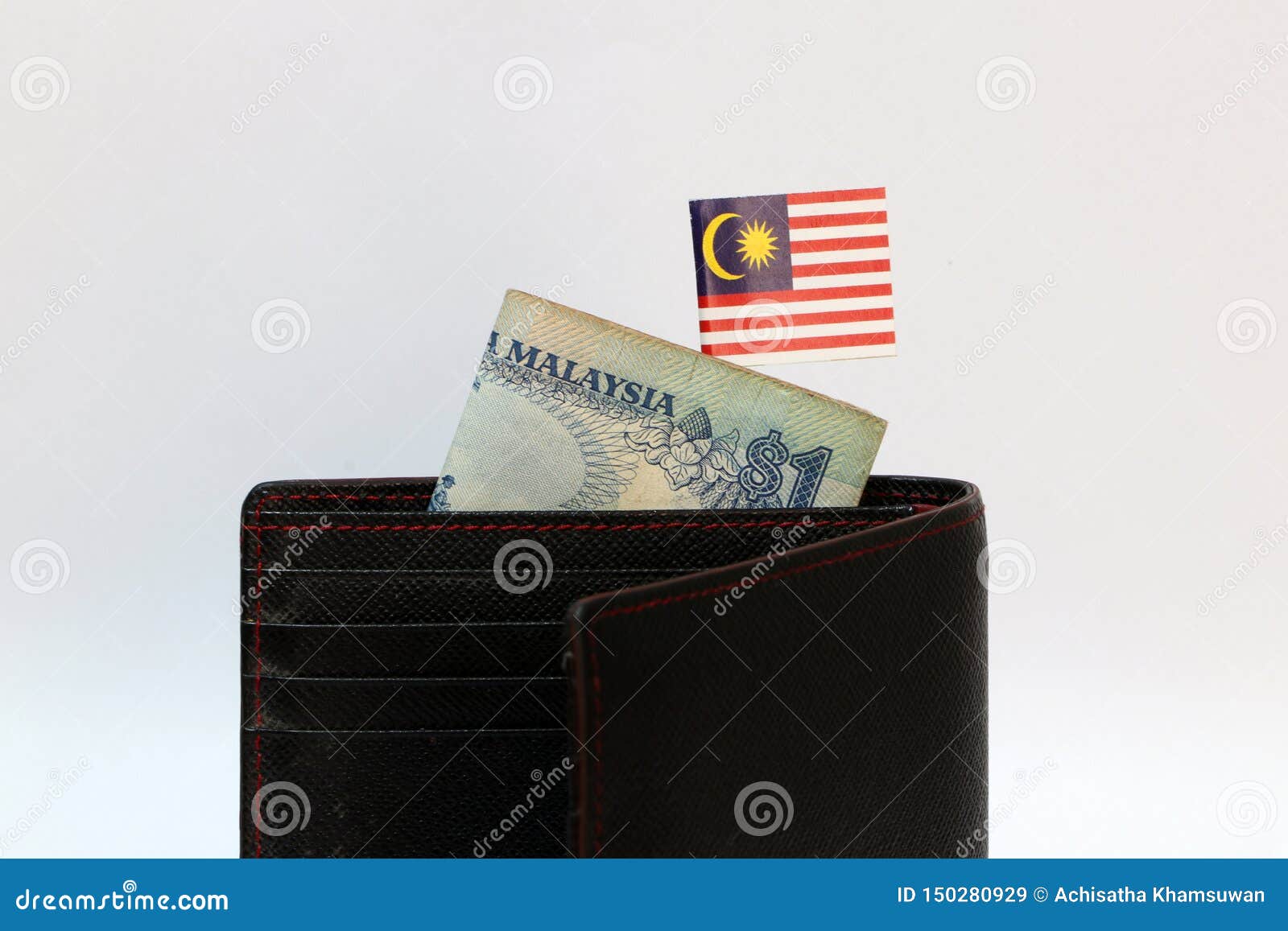 One Ringgit Banknote Of Malaysia And Mini Malaysian Nation Flag Stick