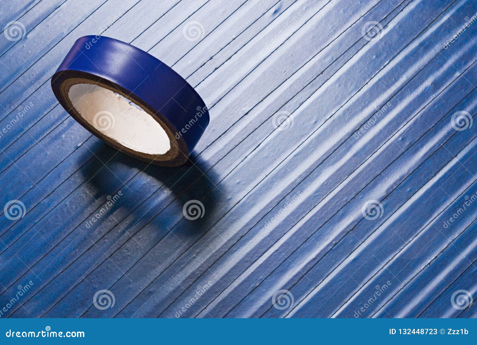 One Roll of Old Blue Pvc Duct Tape on Ti`s Self Flat Background Stock