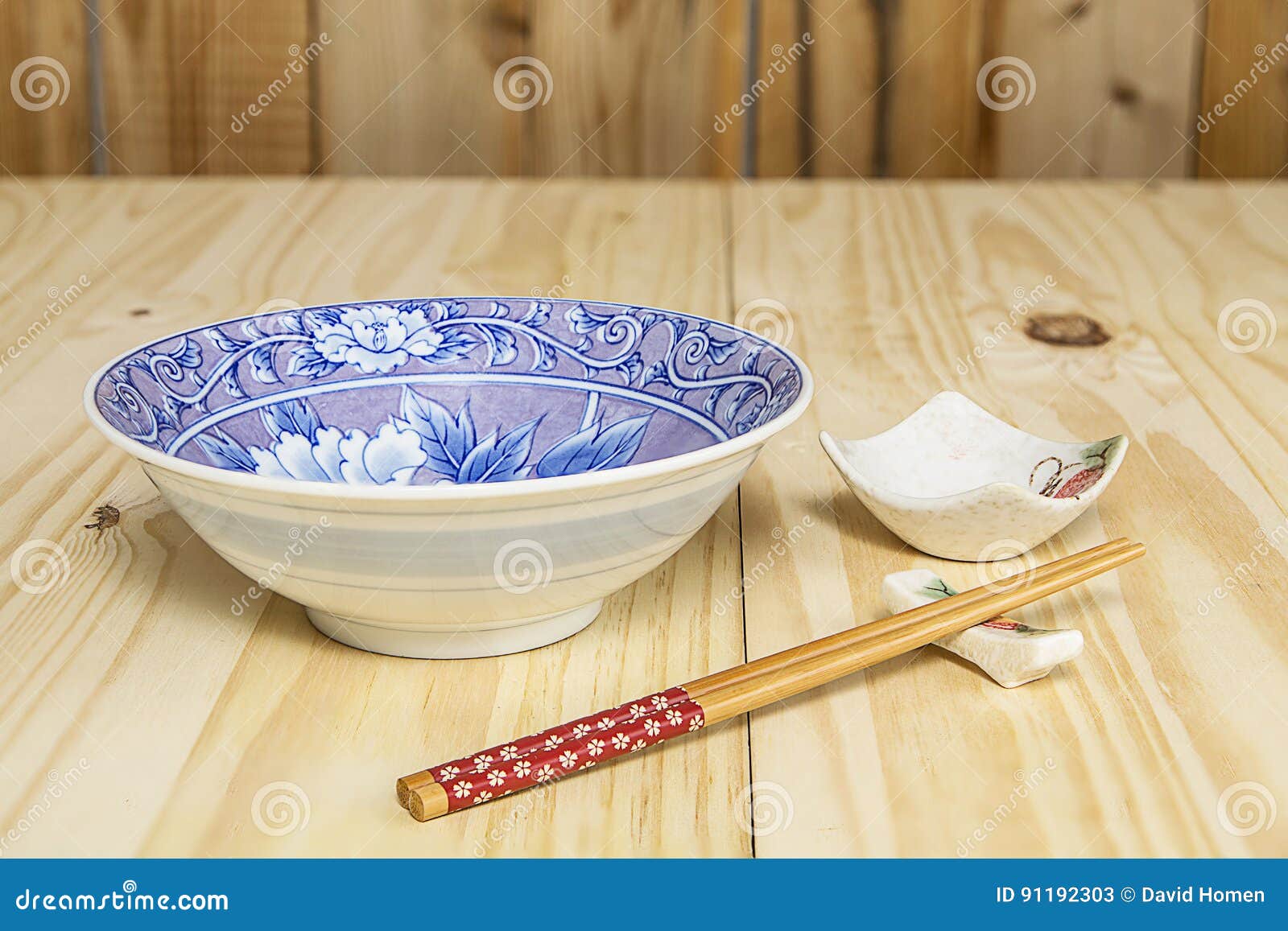 one set of chop sticks, holders, sauce bowl and porcelian bowl