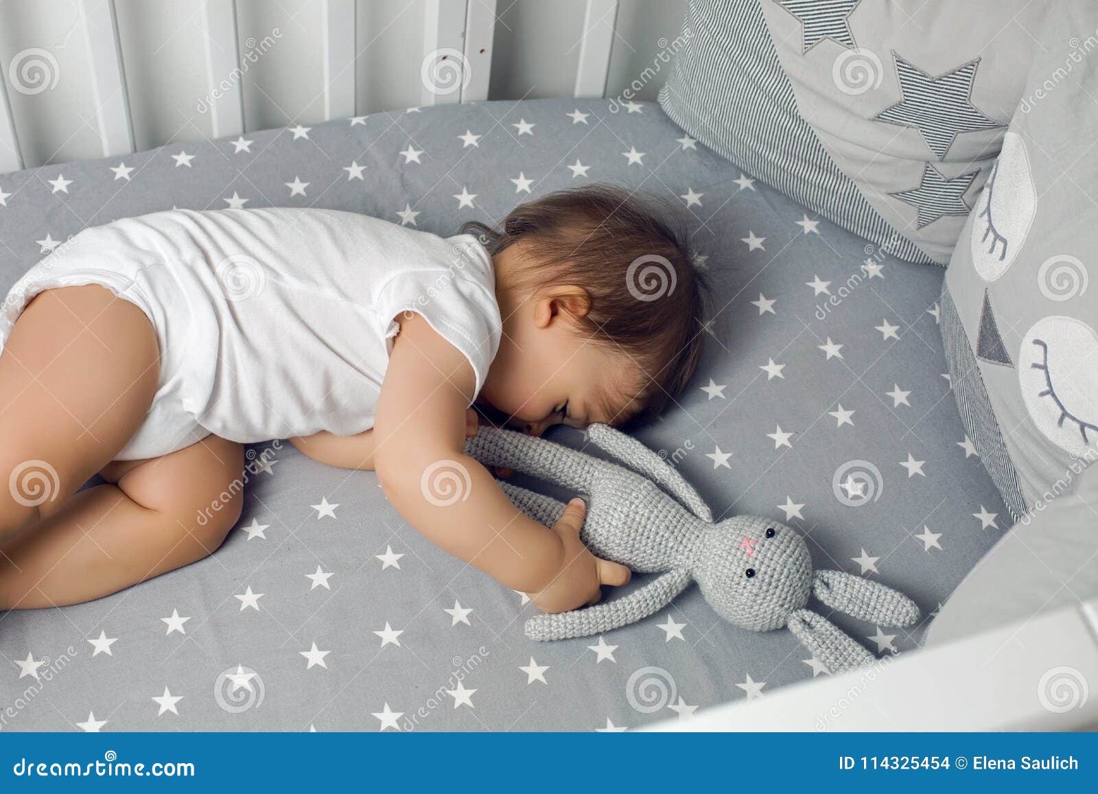 Newborn Baby Lying In Blue Jeans And A Black Scarf by Elena Saulich