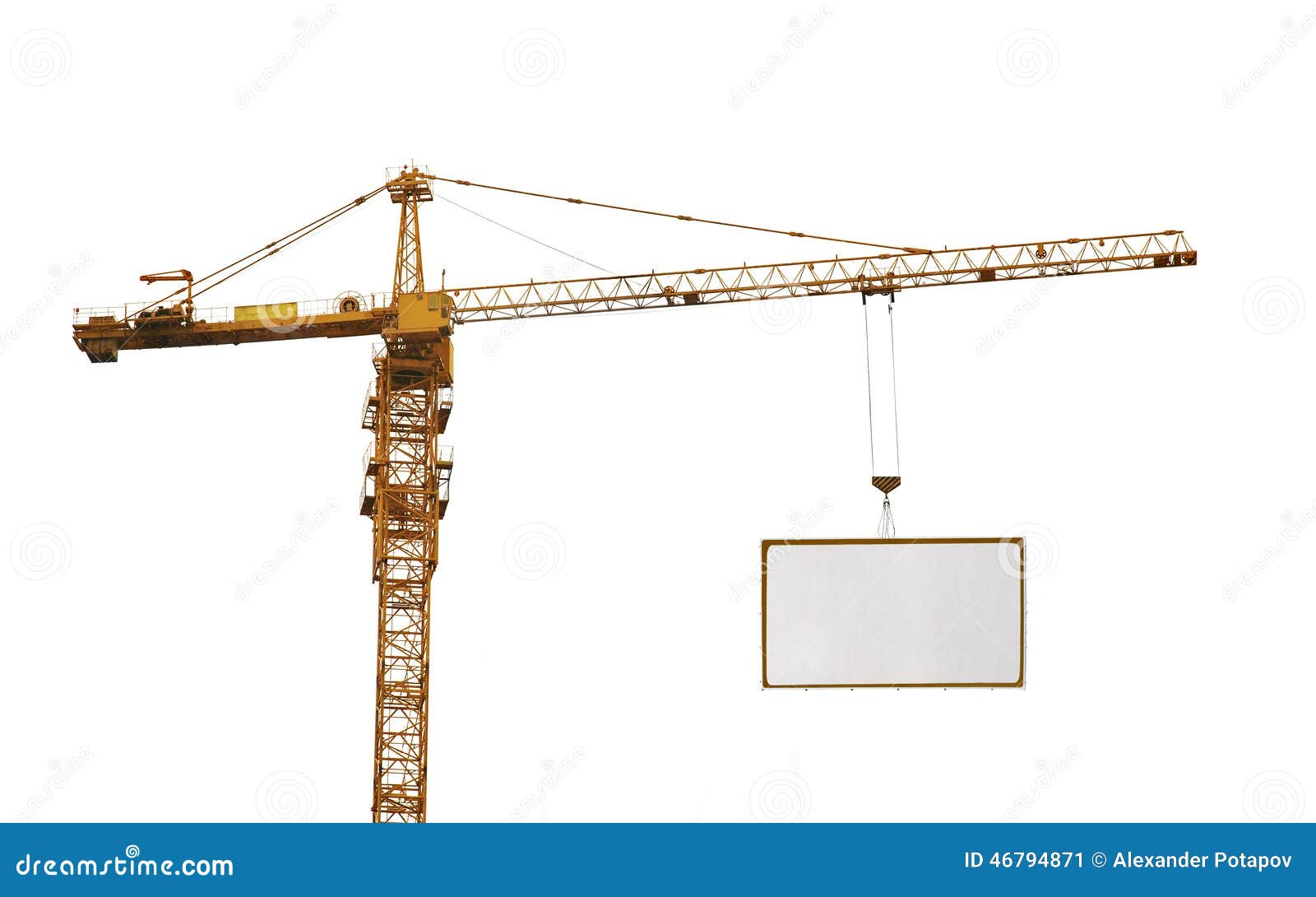 one yellow hoisting crane and advertisement hoardin