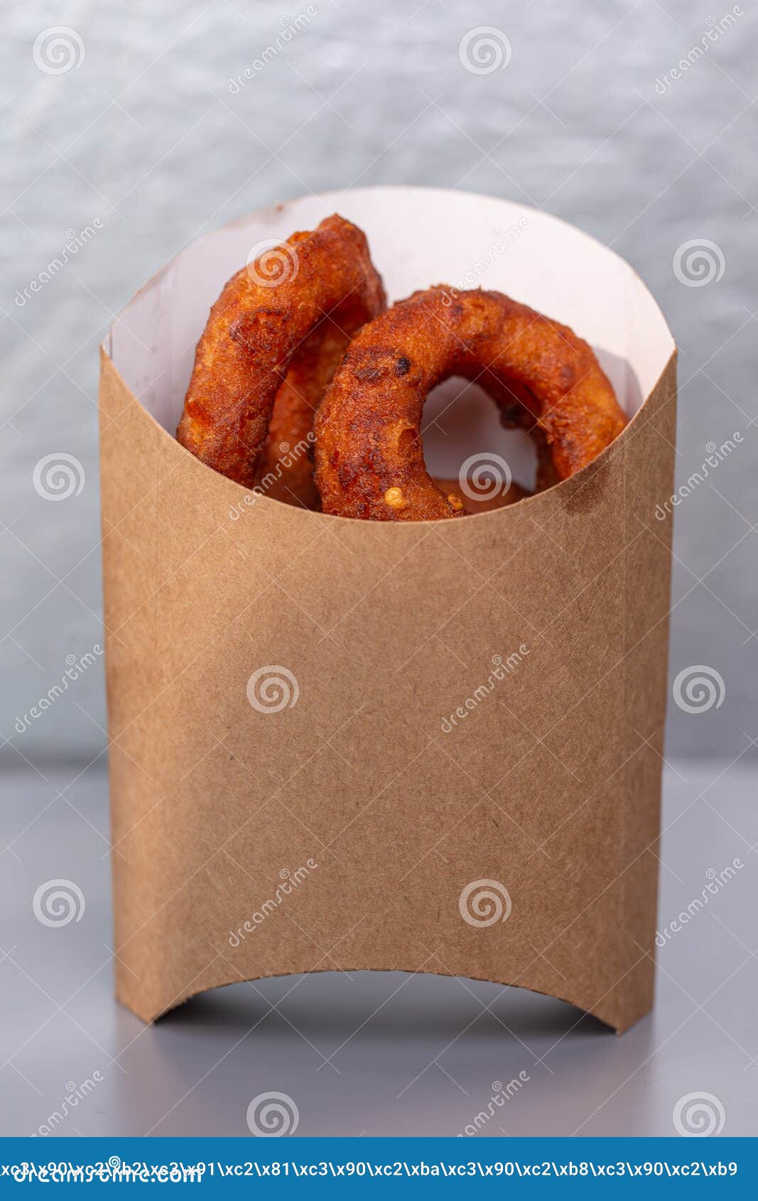 Onion Rings in a Cardboard Bag on a Gray Background Stock Image Image