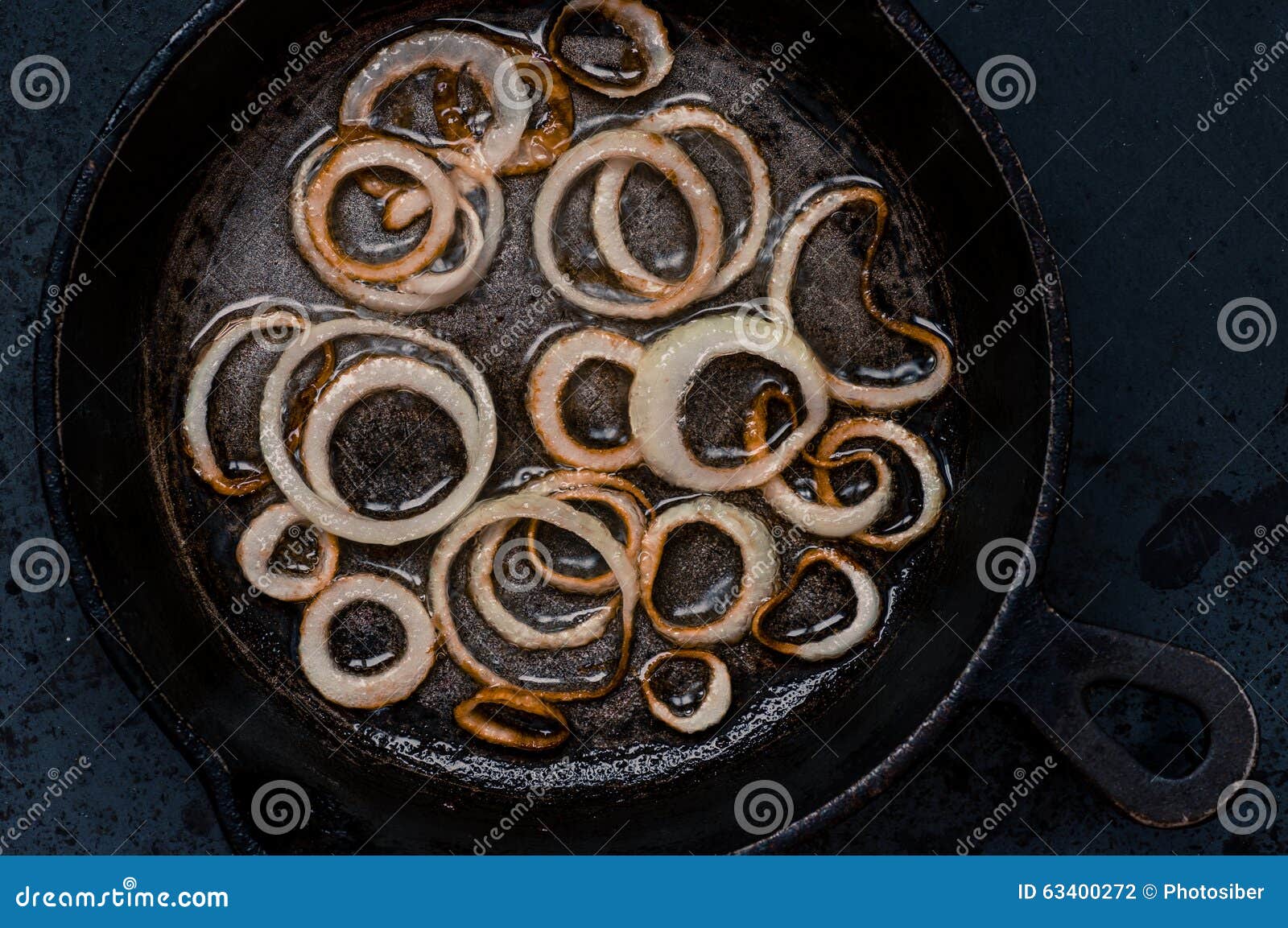 Onion rings in frying pan stock photo. Image of food 63400272