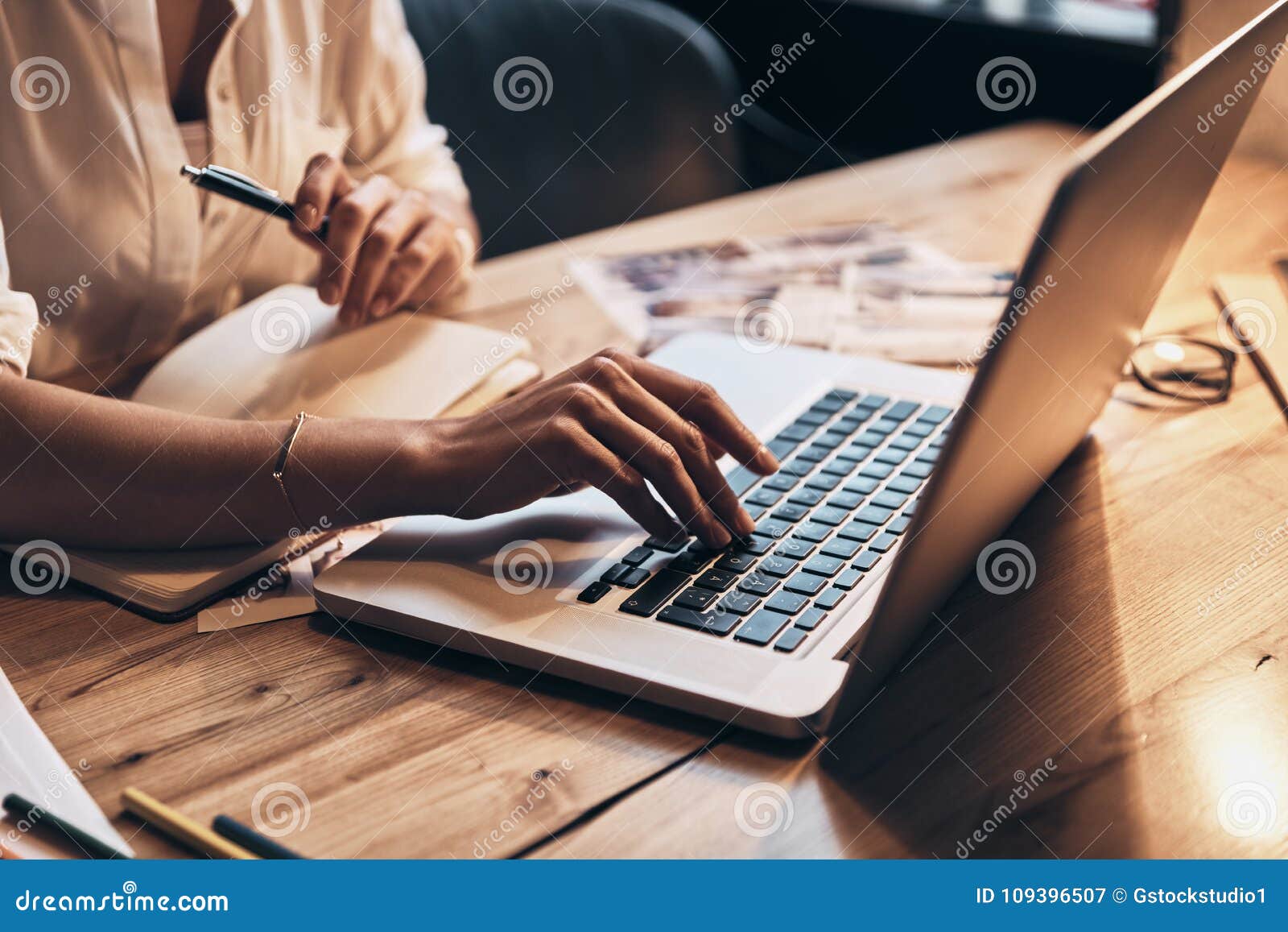 always online. close up of young woman working using computer while sitting in her workshop
