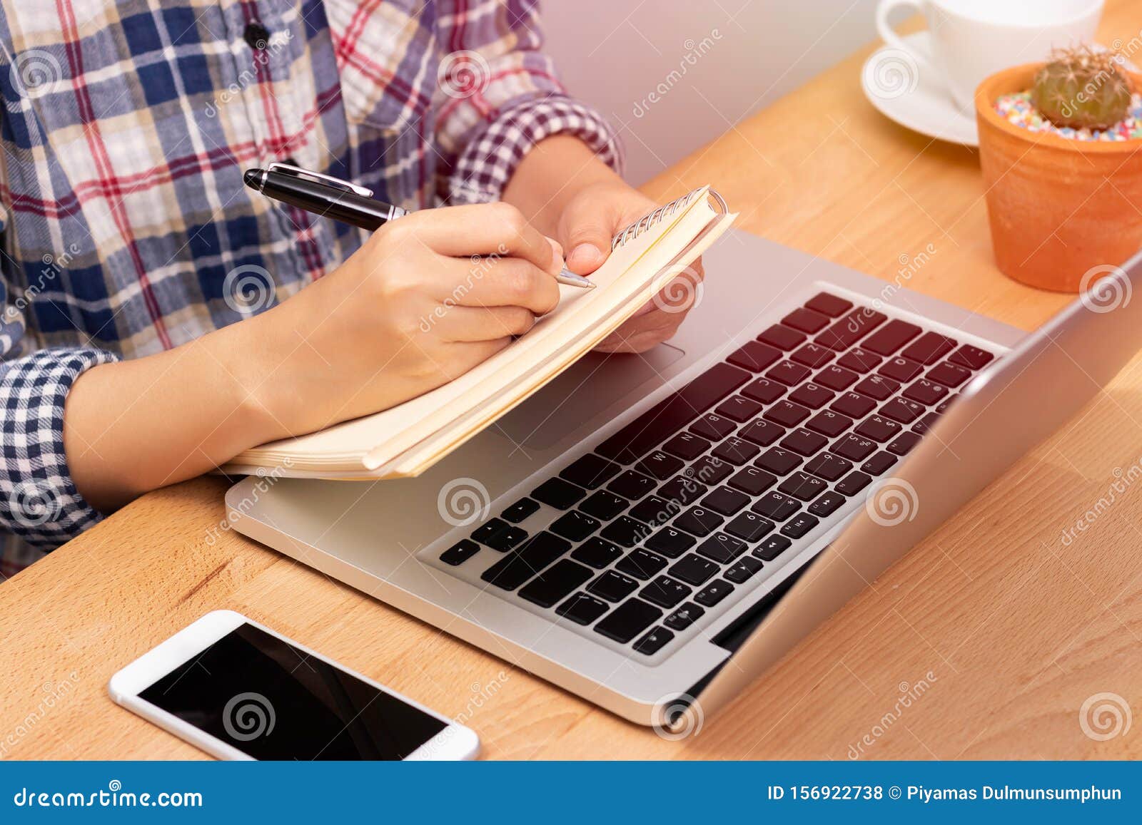 online learning course concept. student using computer laptop for training online course and writing lecture note in notebook.