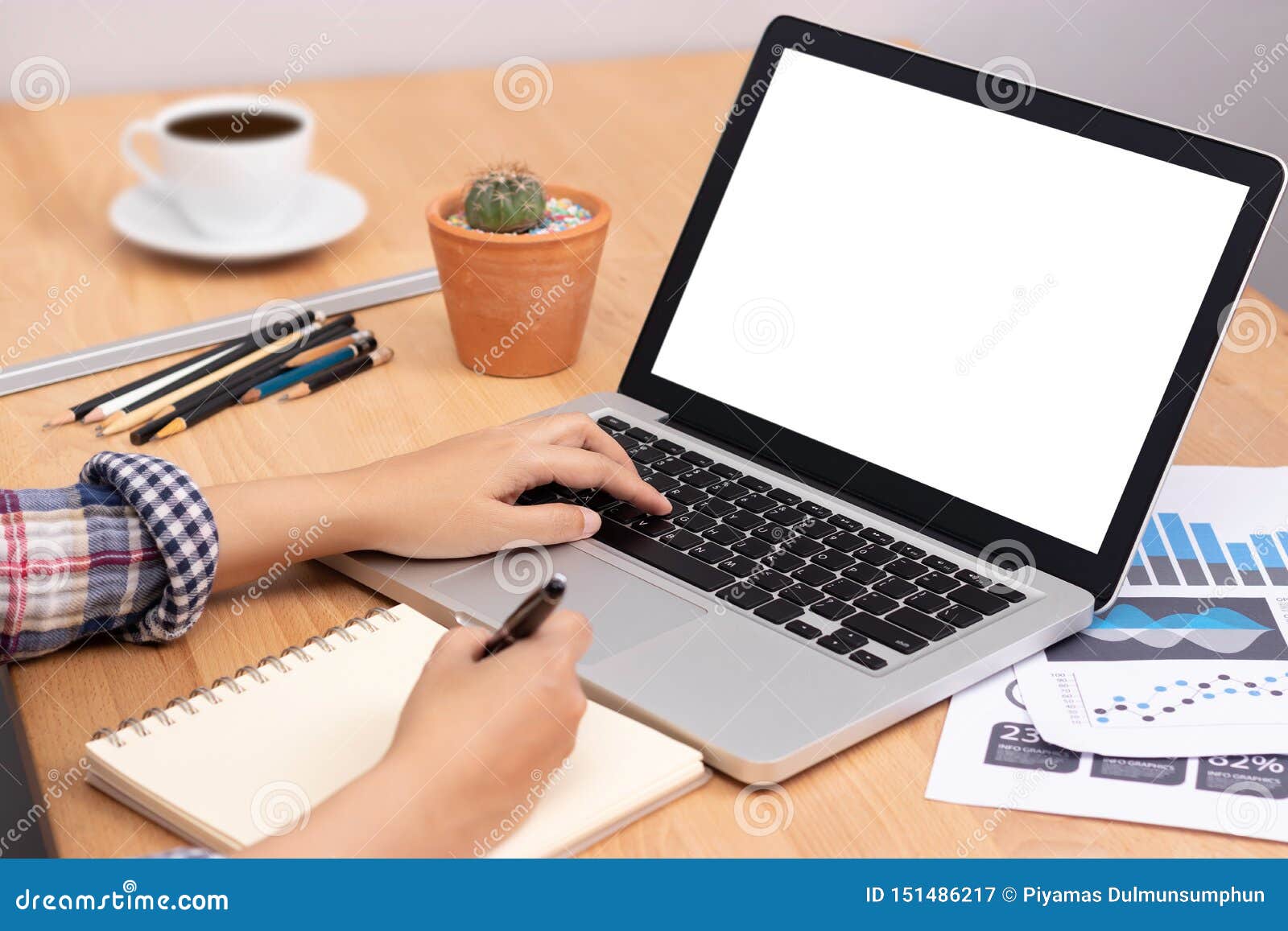 online learning course concept. student using computer laptop with white blank screen for training online and writing lecture note