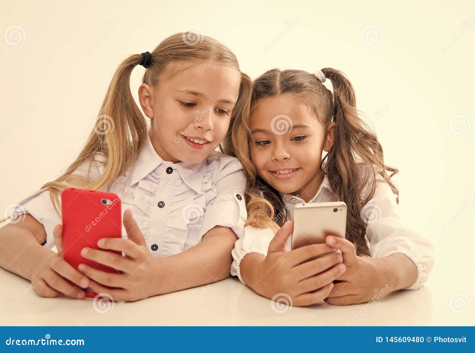 Online Life Concept. Schoolgirls Cute Pupils Use Smartphones Big ...