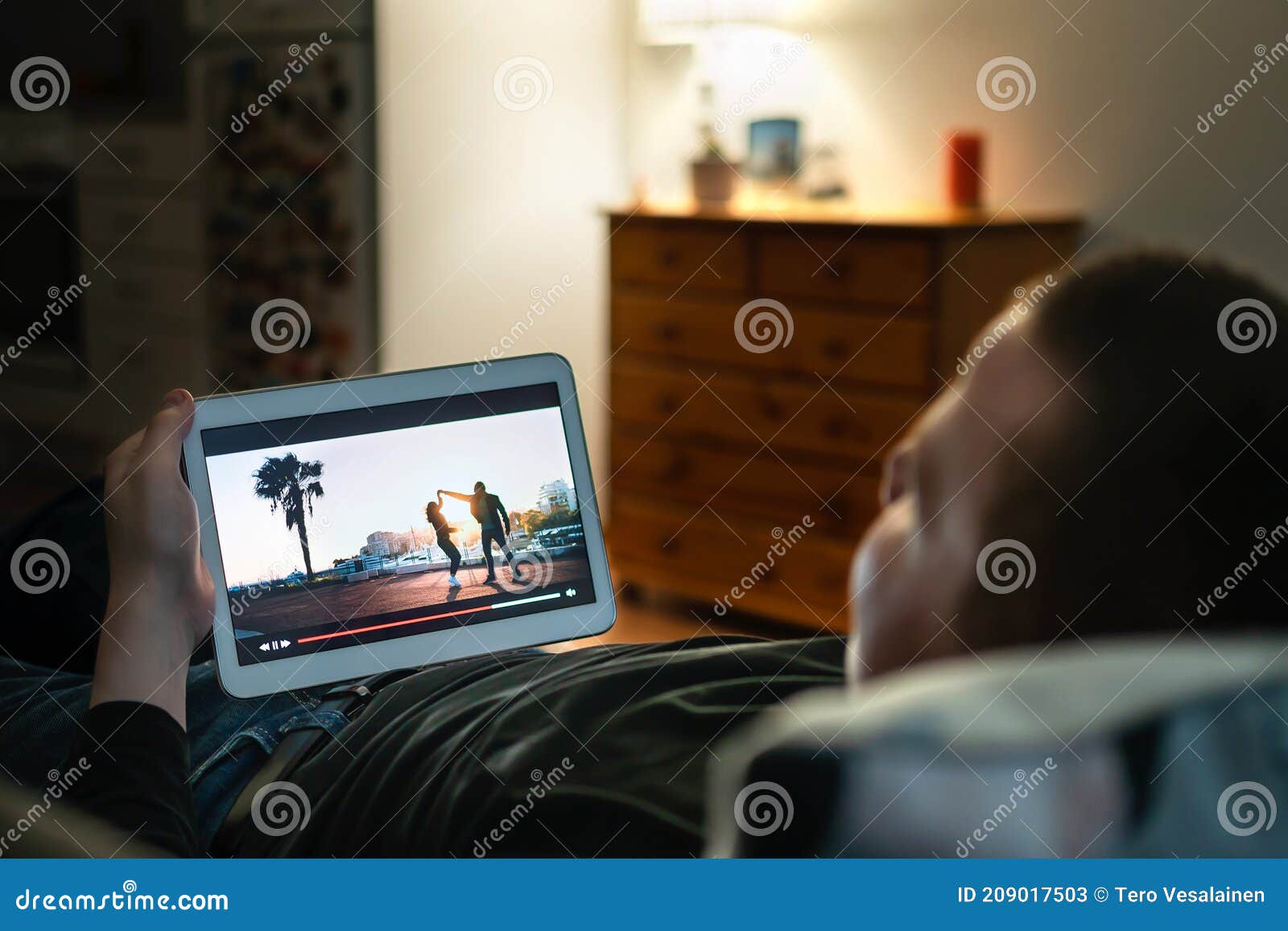 Online Movie Stream in Tablet Screen Home at Night