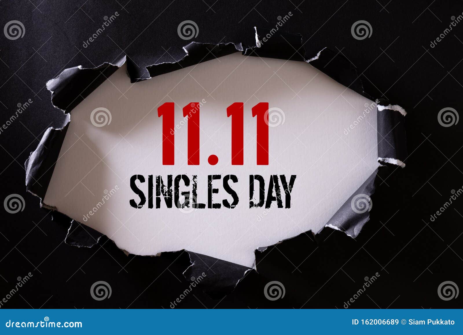 online shopping of china, 11.11 singles day sale concept. top view of black torn paper and the text 11.11 singles day sale on a