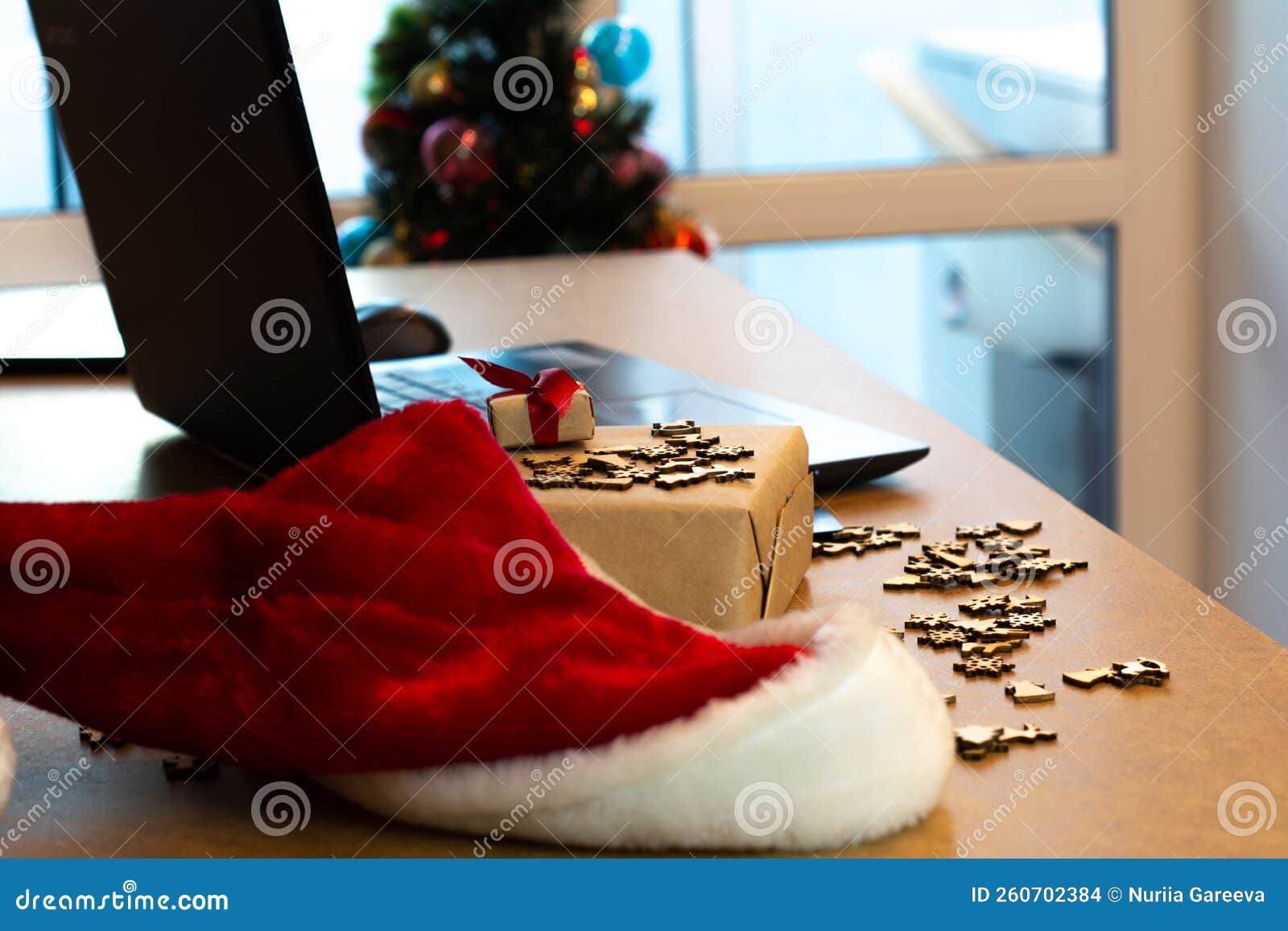 online shopping at christmas, happy new year. santa`s hat, gifts, laptop, wallpaper, picture, postcard