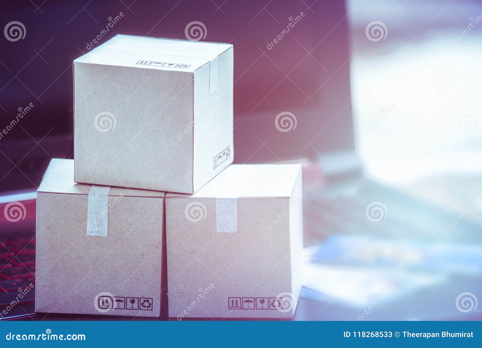 online shopping concept e-commerce delivery buying service. square cartons shopping on laptop keyboard, showing customer order vi