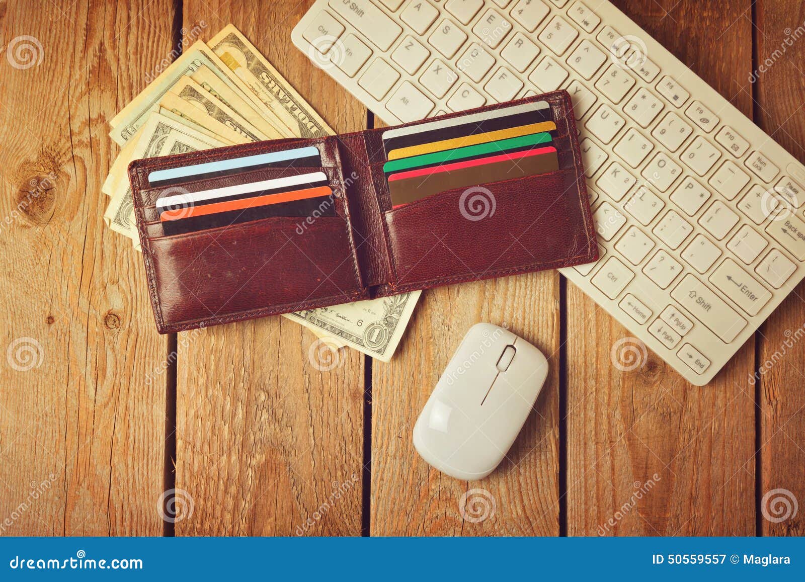 online shopping concept with wallet, money and keyboard. retro filter effect