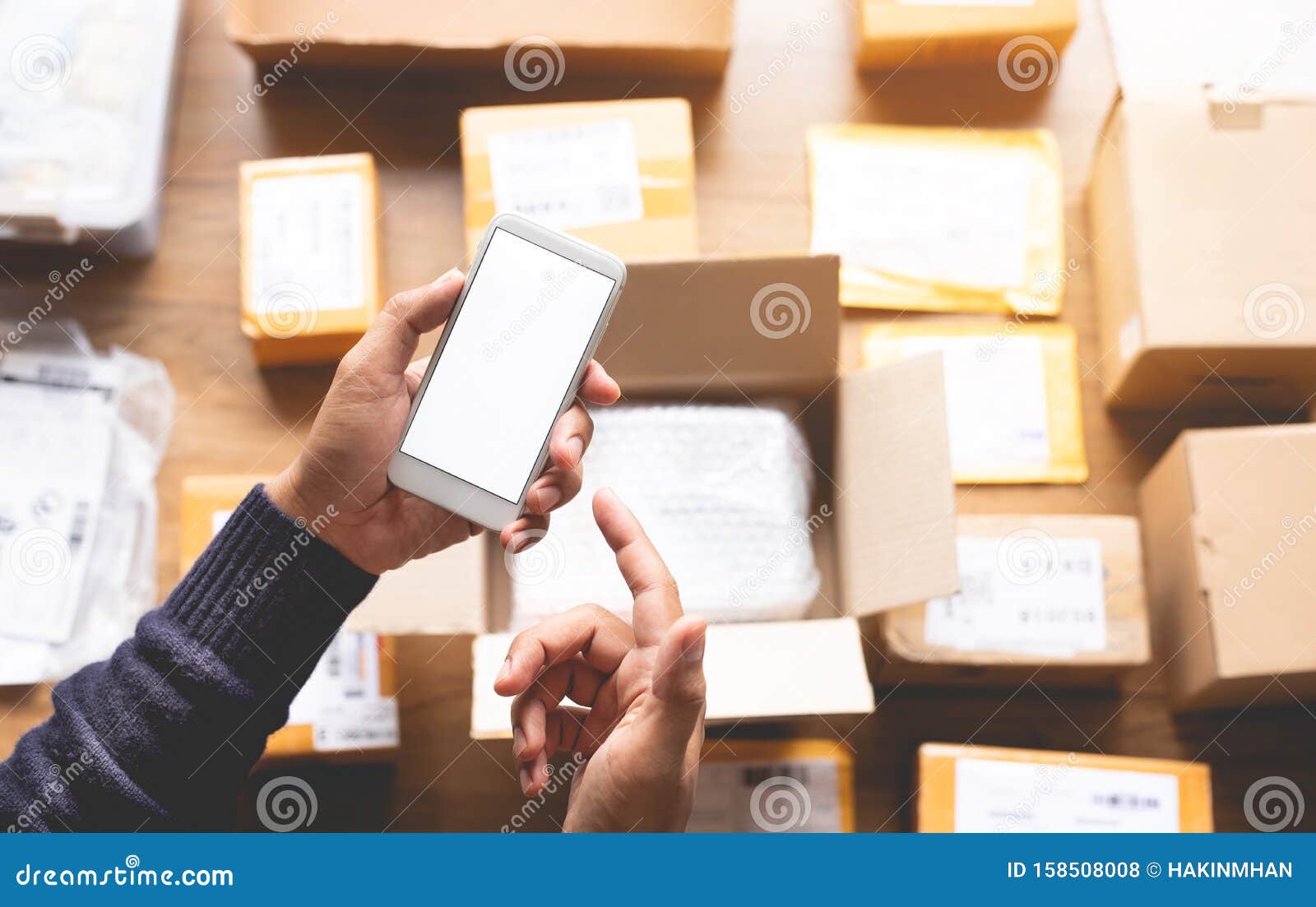 online shopping  with youngman using smartphone on a lot of package box.ecommerce market.transportation logistic