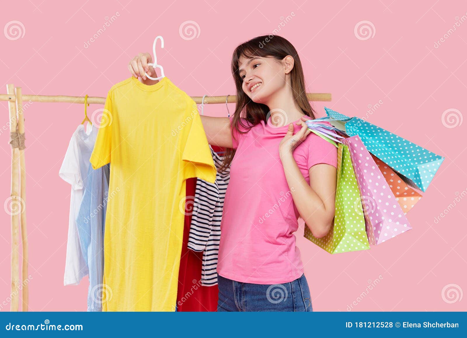 Online Shopping. Young Asian Woman with Shopping Bags Tries on Colorful ...