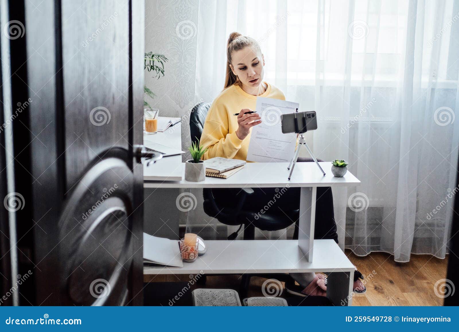 online side hustle ideas to make money fast. young woman speaking in front of camera for vlog as consultant, blogger
