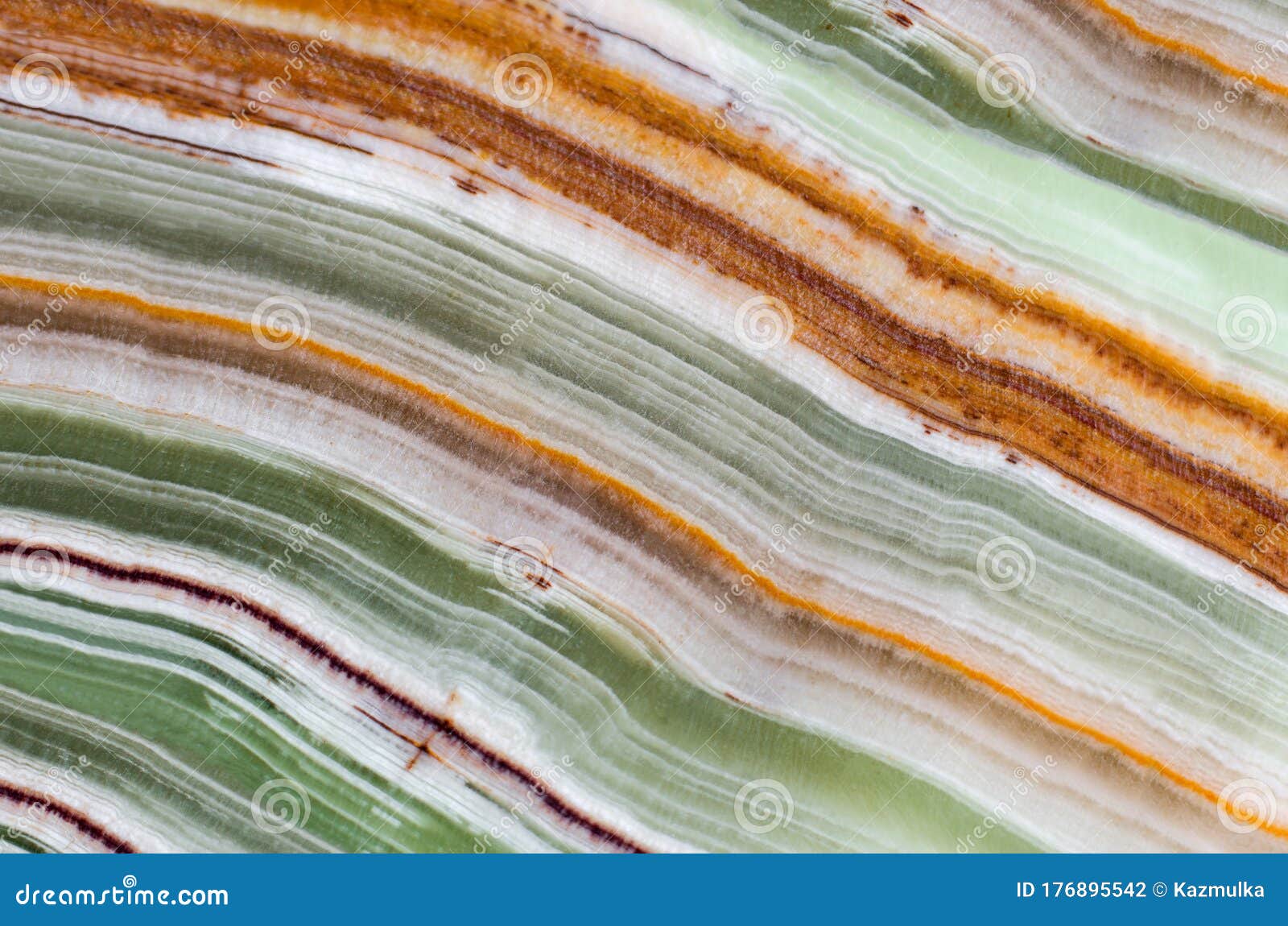 onyx gemstone texture close up. green, white, brown and orange stripes. natural stone mineral background