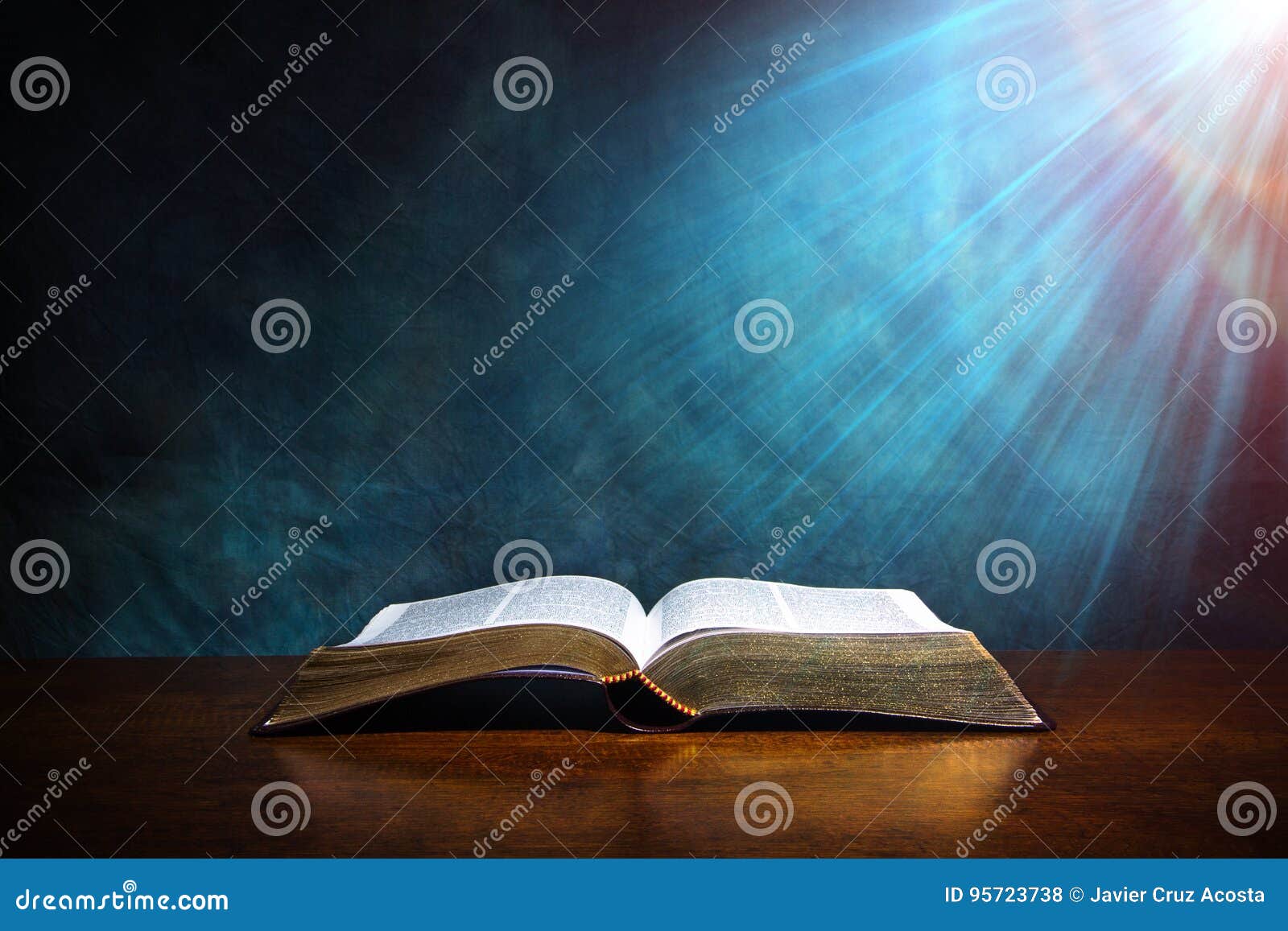 open bible on a wood table