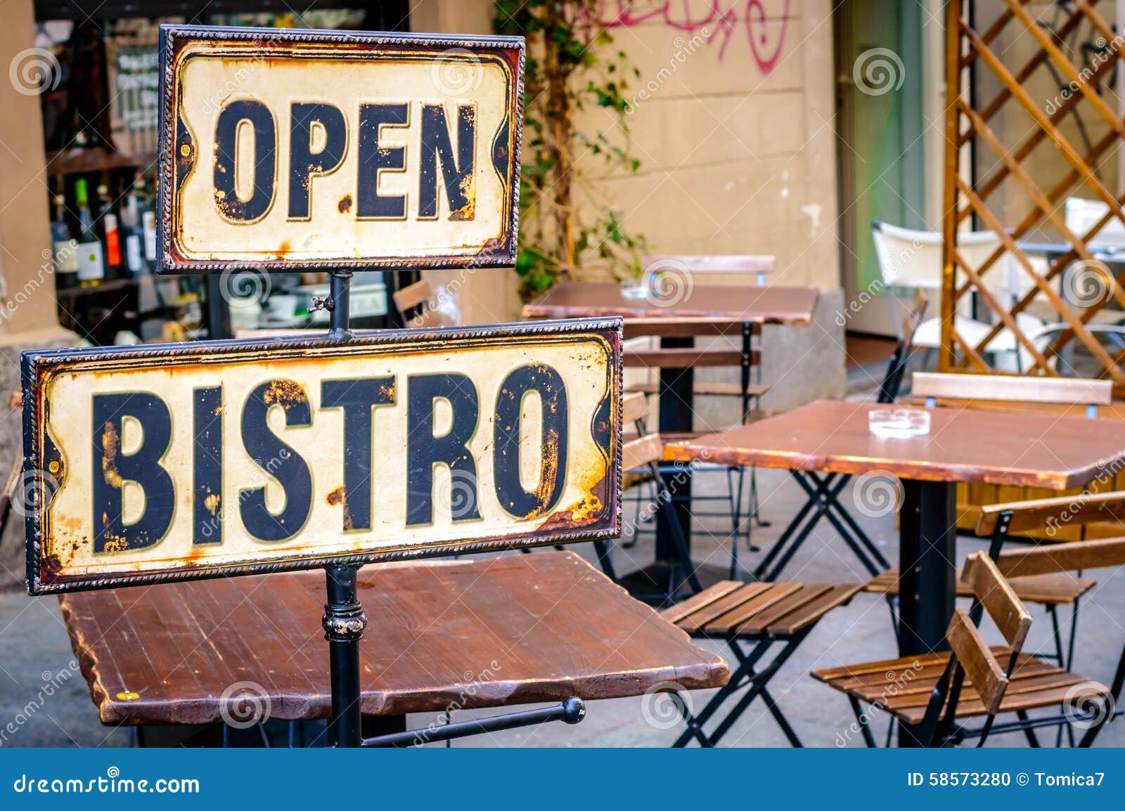 open bistro sign at the empty caffe terrace