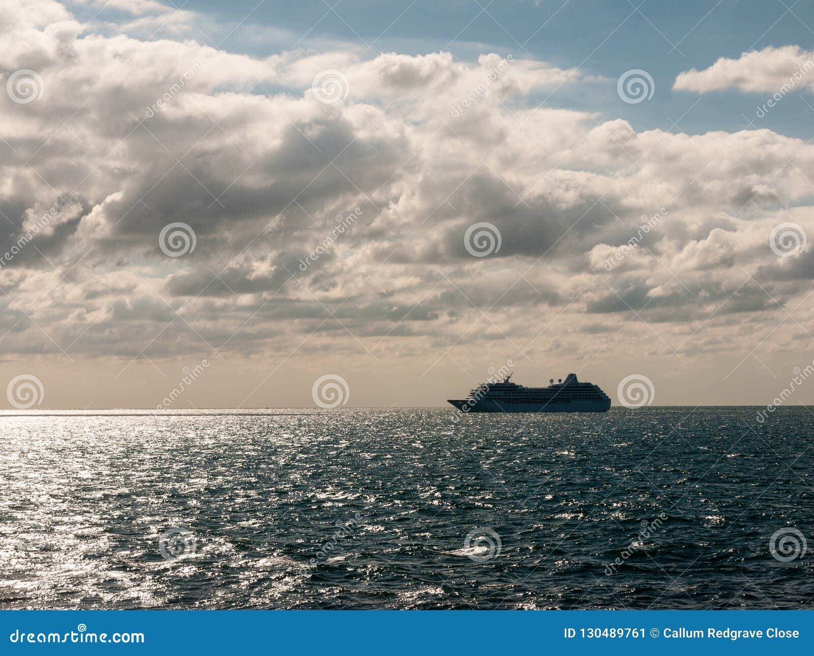 Open Blue Ocean Large Boat Transport Shipping Clouds