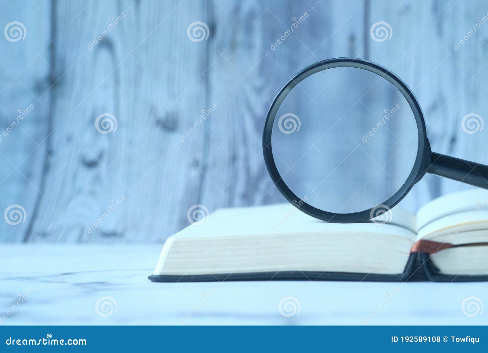 Open Book and Magnifying Glass on Table. Stock Photo Image of optical