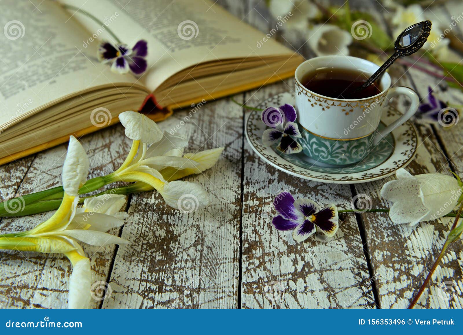 https://thumbs.dreamstime.com/z/open-book-poetry-old-cup-tea-flowers-table-vintage-still-life-literature-reading-concept-156353496.jpg