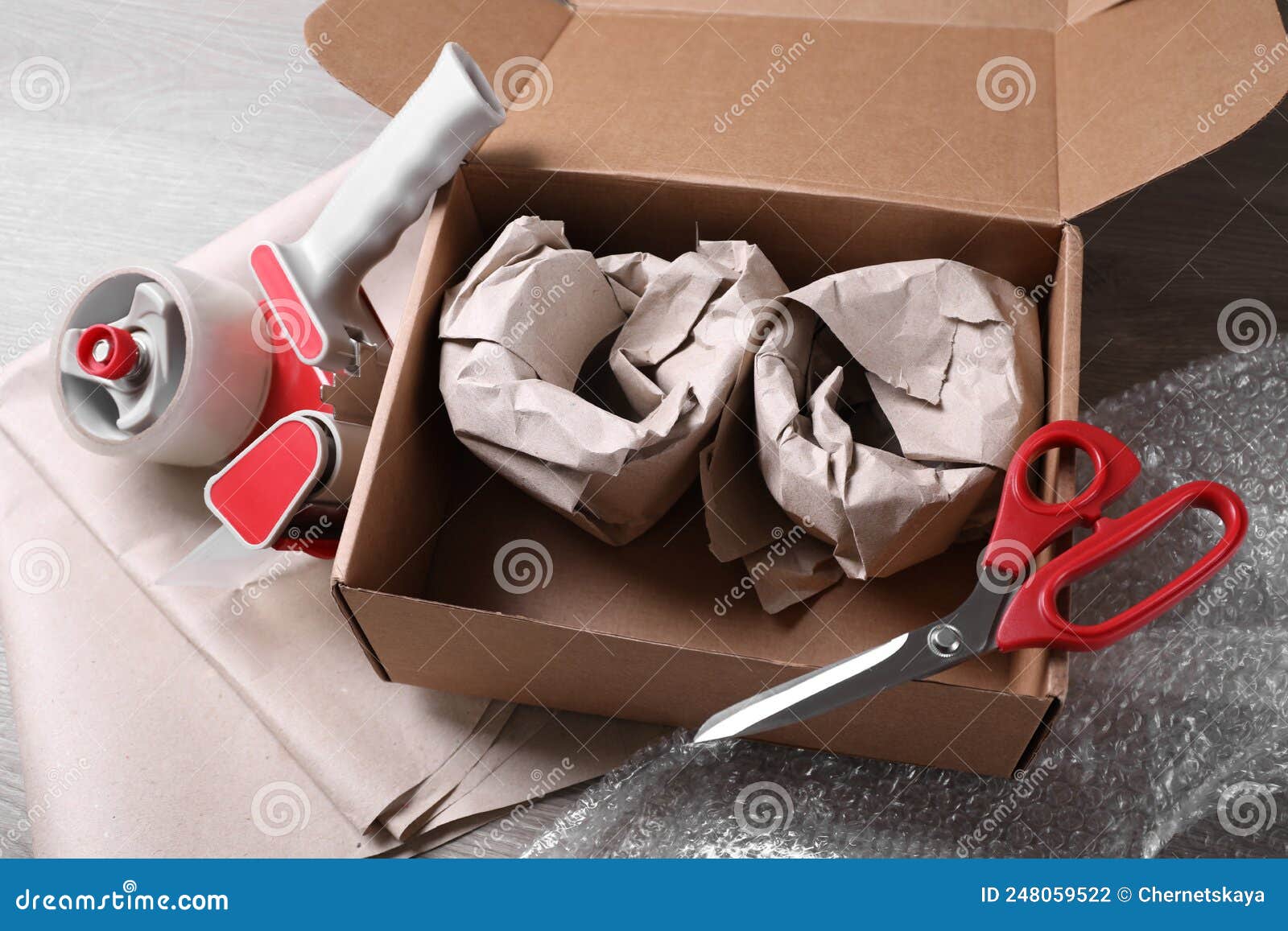 Gift wrapping with boxes and scissors Stock Photo by ©karandaev