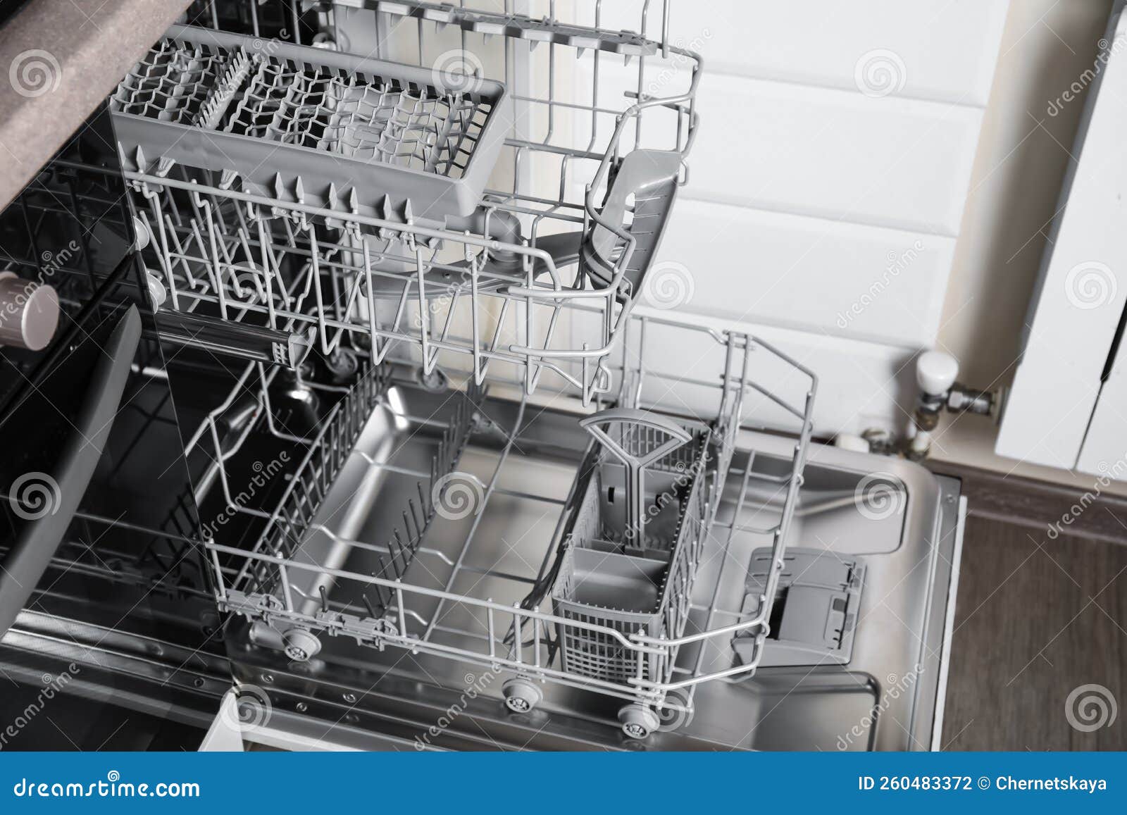 Open Clean Empty Dishwasher in Kitchen, Closeup Stock Photo Image of