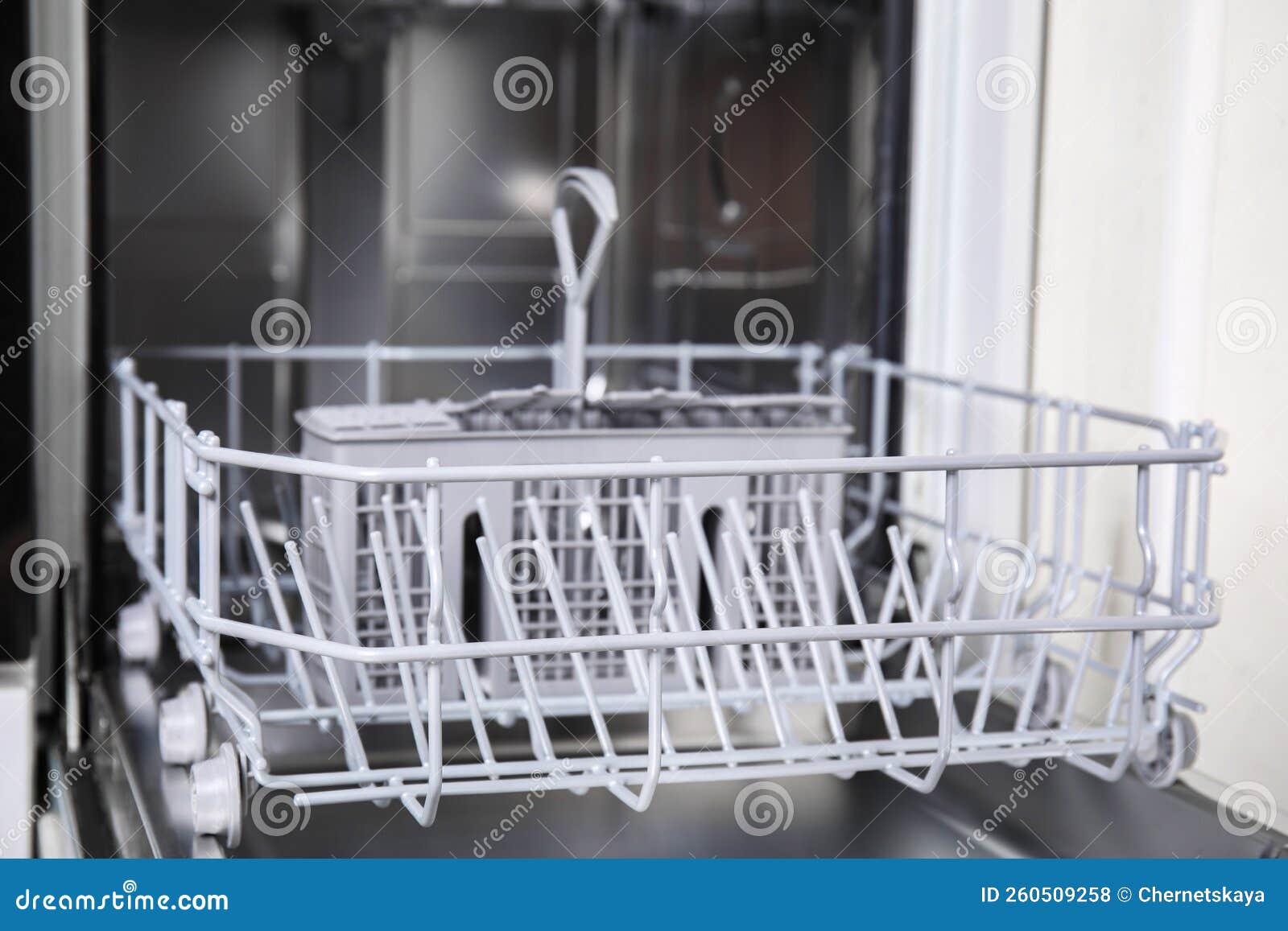 Open Clean Empty Dishwasher in Kitchen, Closeup Stock Photo Image of