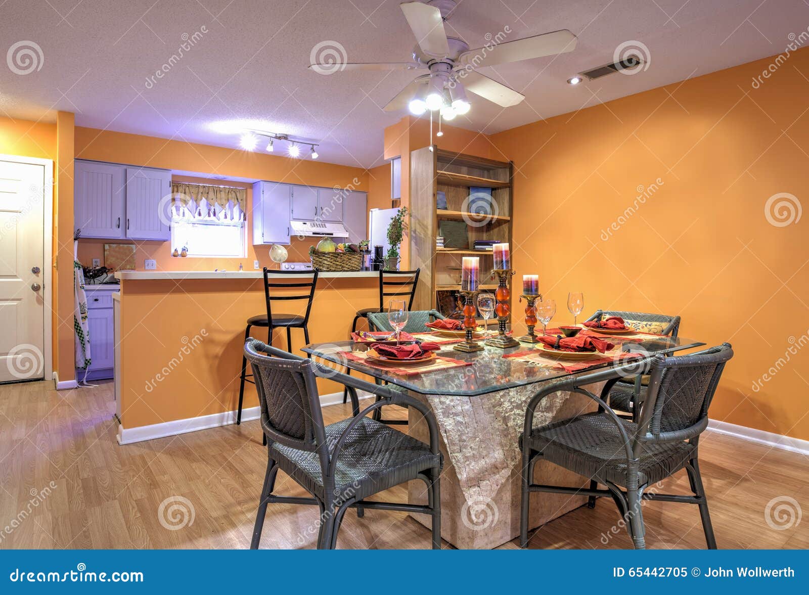 Open Concept Apartment Diningroom Kitchen Orange Walls 65442705 