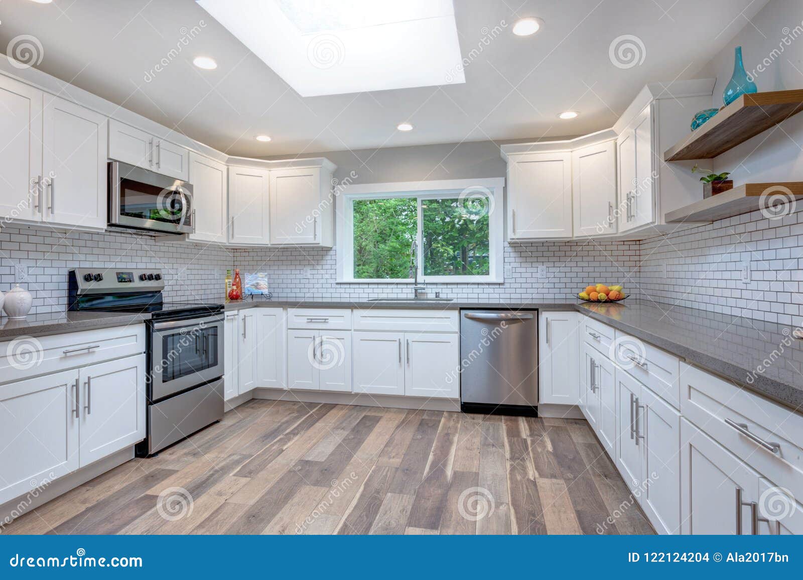 Open Concept Kitchen Equipped With Stainless Steel Appliances