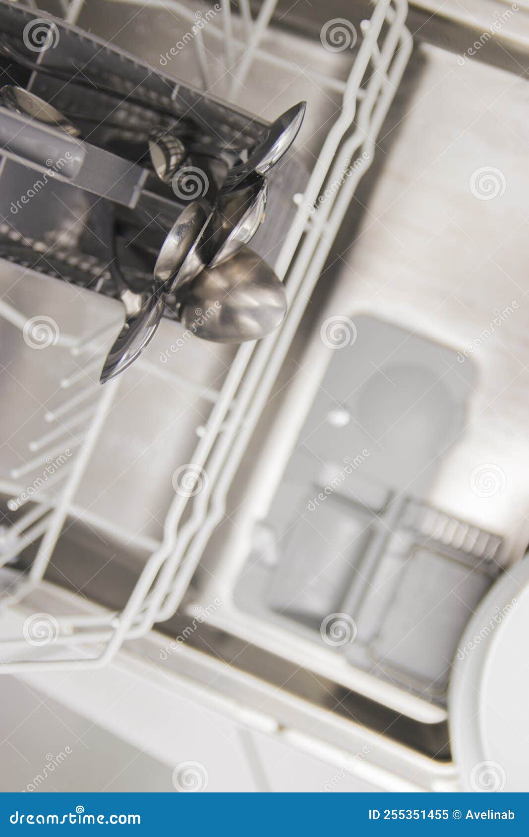 Open Container, Compartment of a Dishwashing Machine Close Up