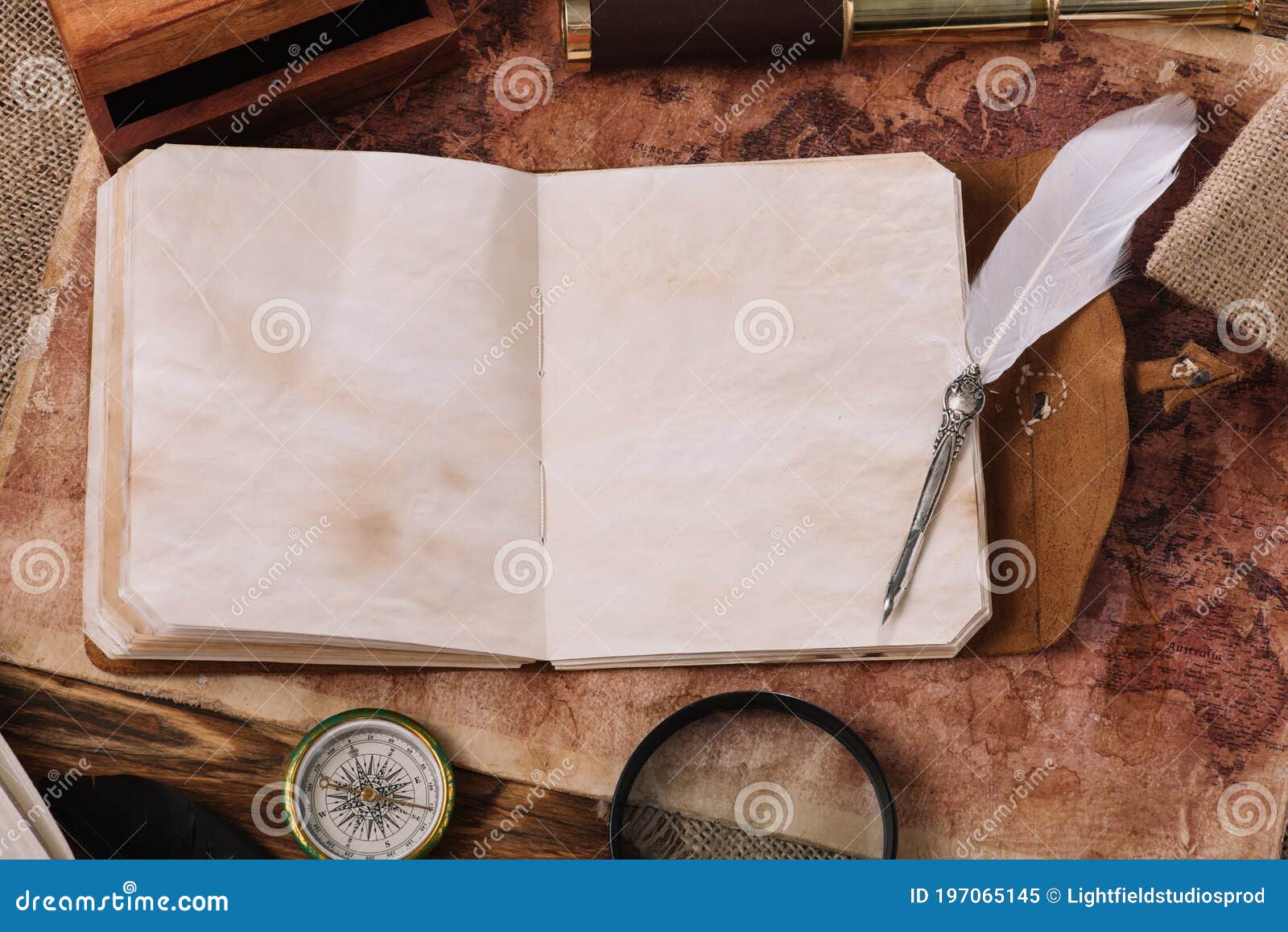 copy book with blank pages and nib on old world map