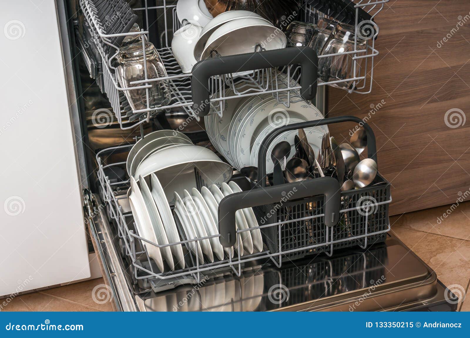 Open Dishwasher with Clean Dishes after Cleaning Process Stock Image