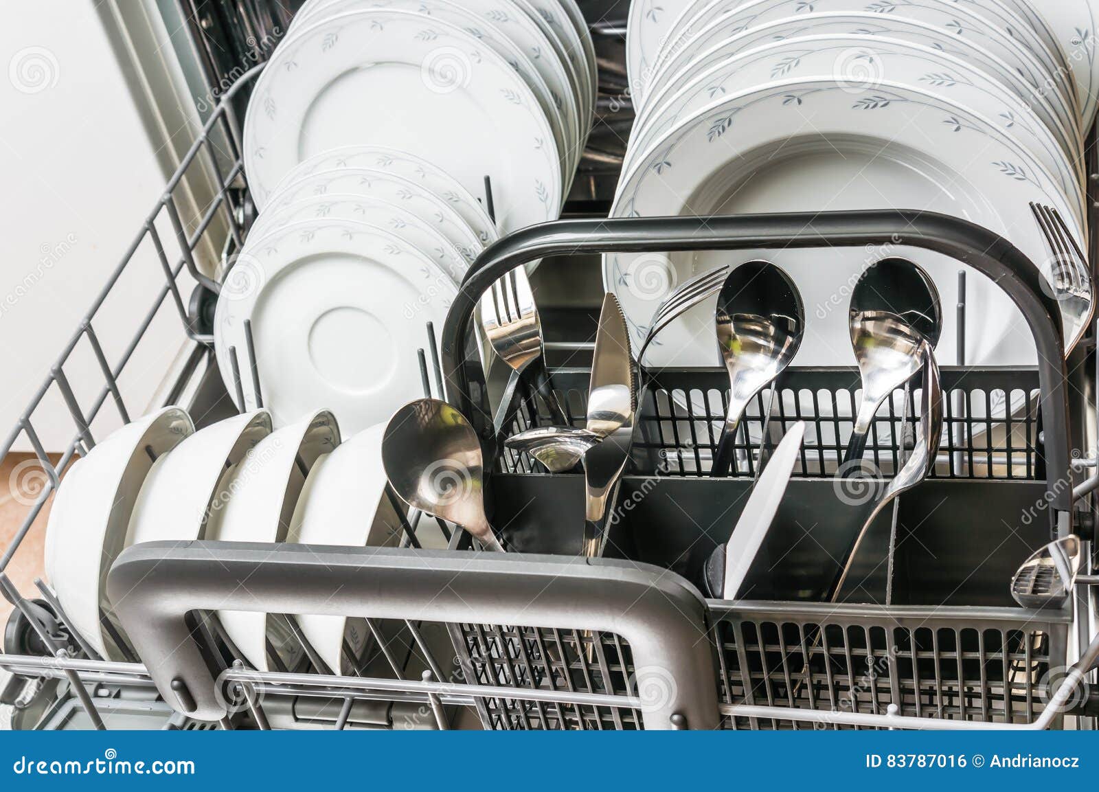 Open Dishwasher with Clean Dishes after Cleaning Process Stock Photo