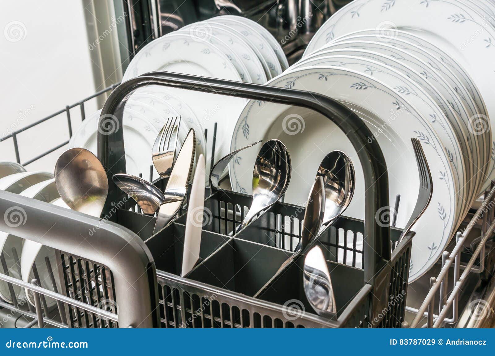 Open Dishwasher with Clean Dishes after Cleaning Process Stock Image