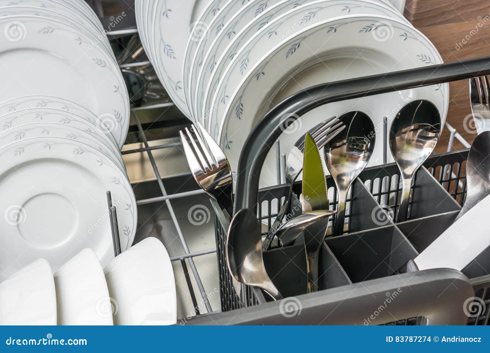 Open Dishwasher with Clean Dishes after Cleaning Process Stock Photo