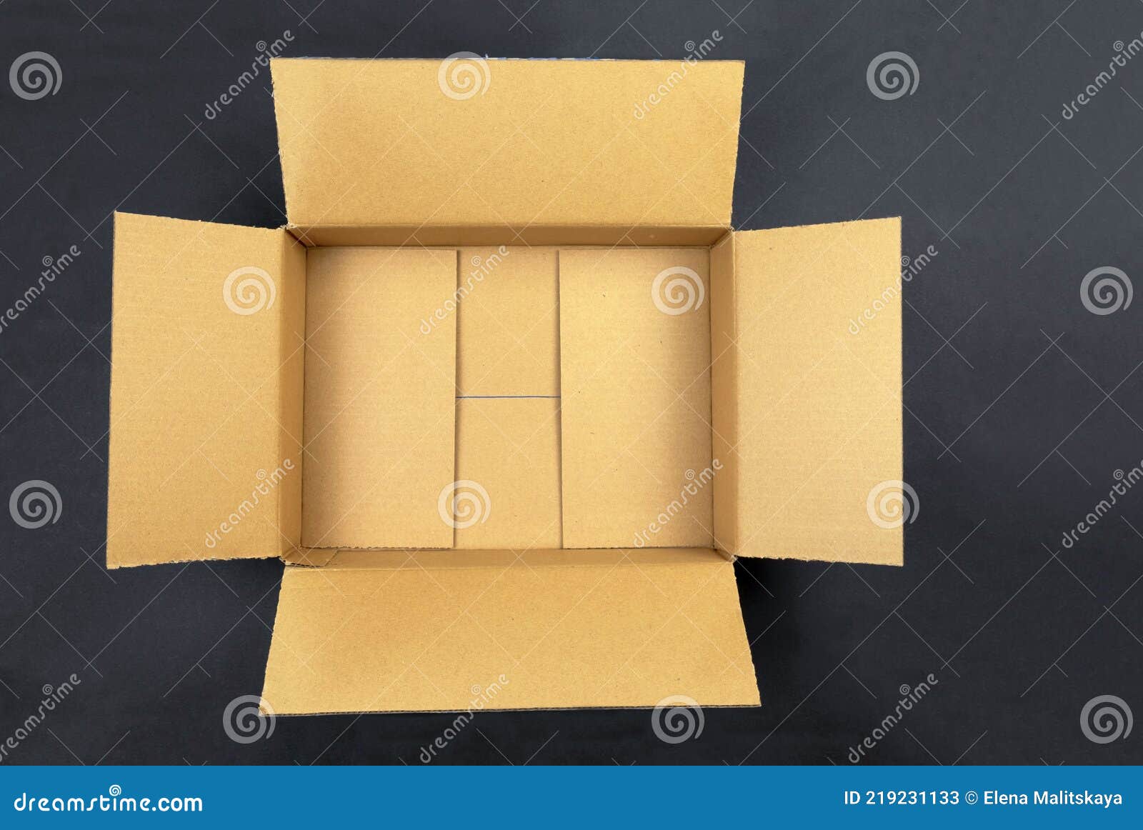 Open Empty Brown Cardboard Box on Black Background. Concept Delivery