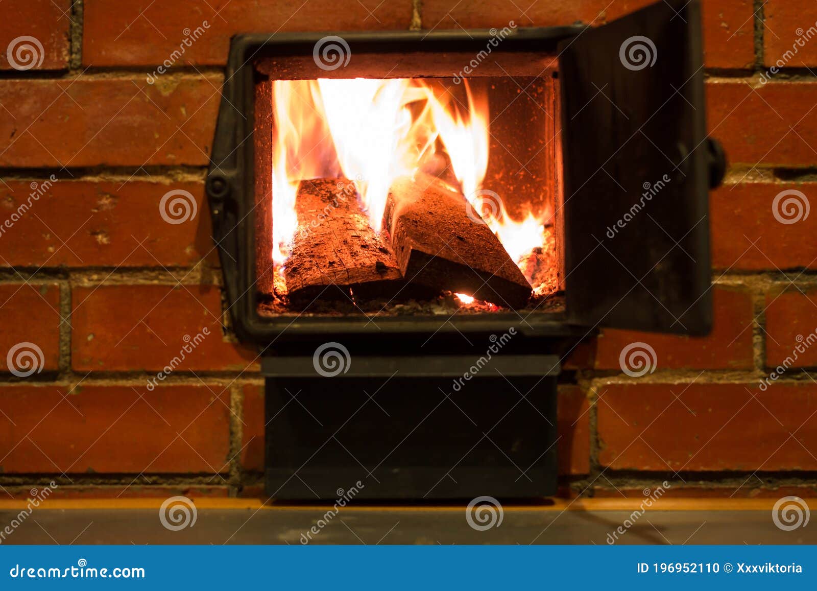 Open Firebox of the Stove with Burning Firewood. Brick Oven. Firewood