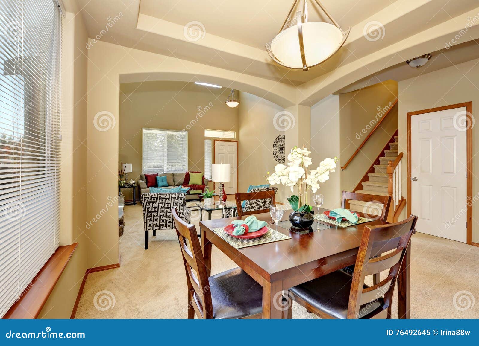 Open Floor Plan Dining Area And Living Room With Entryway Stock