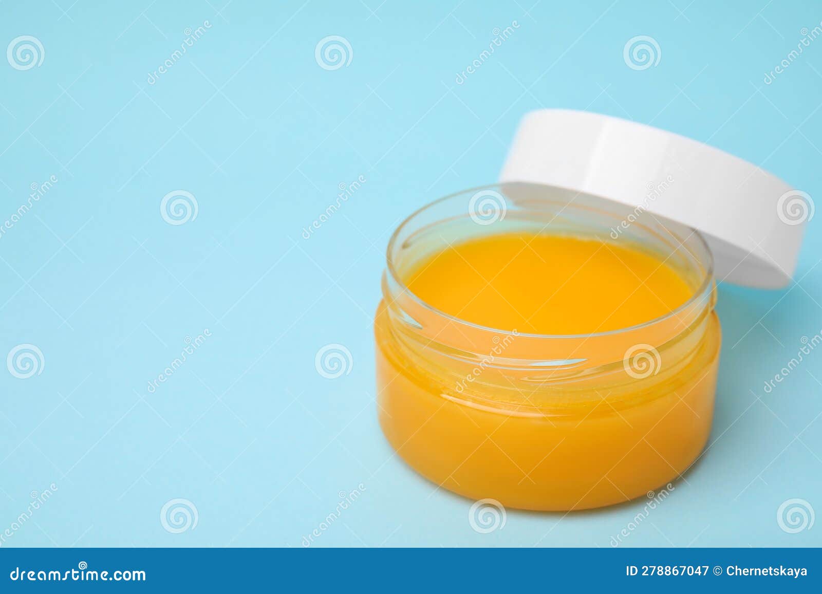 Open Jar of Petrolatum on Light Blue Background. Space for Text Stock ...