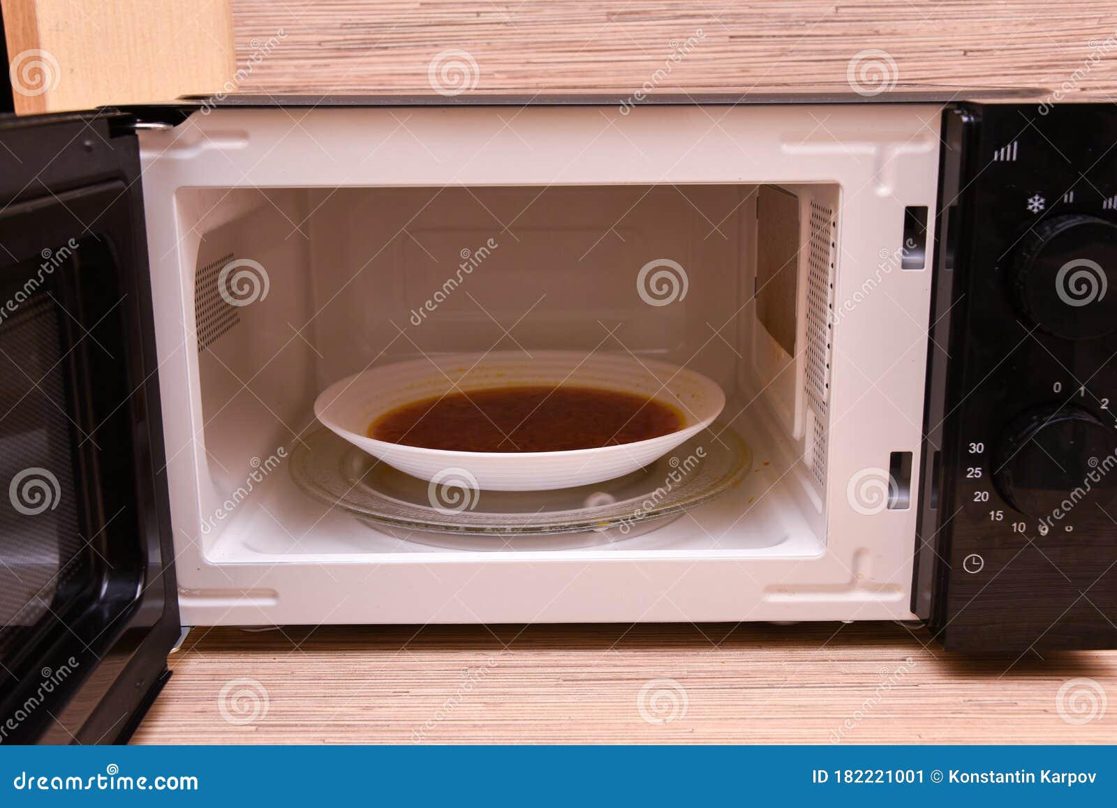 Open Microwave with Soup Inside. Image of the Microwave Oven Stock