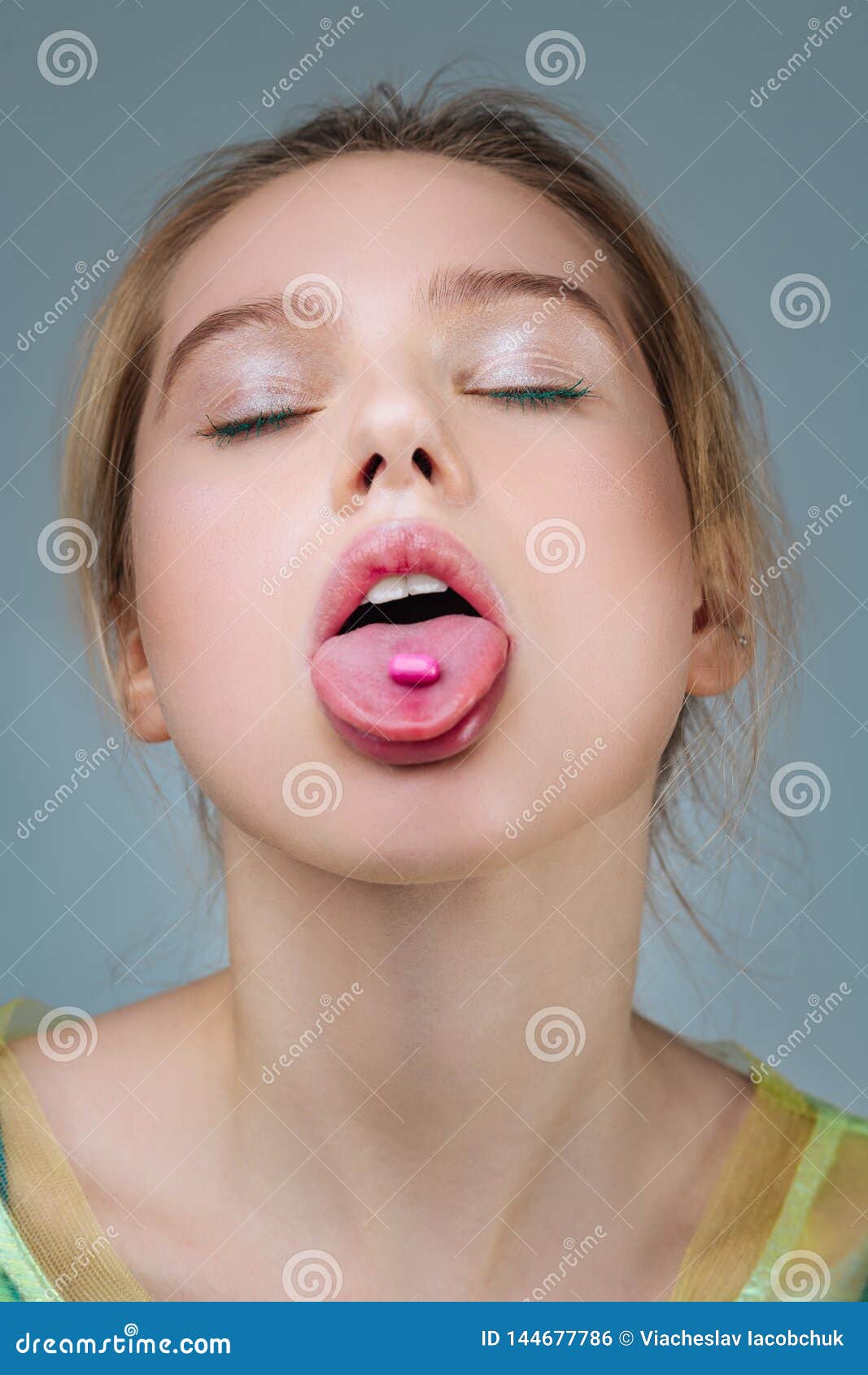 fair-haired model with natural makeup posing with open mouth
